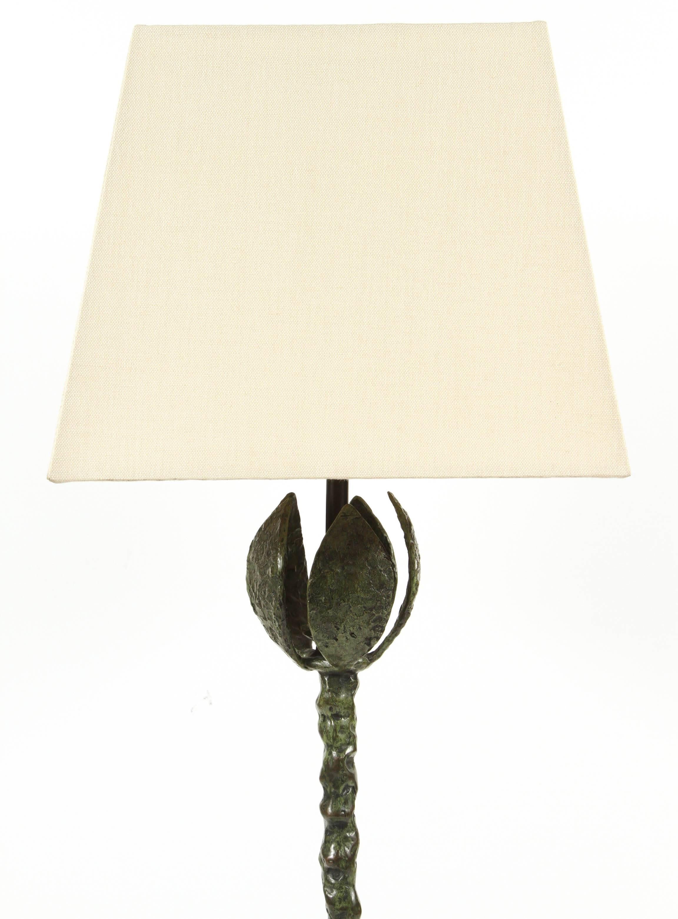 Gorgeous bronze table lamp from an authorized reproduction line of Diego Giacometti's original creations by the Nelson Rockefeller Collection, Inc. This particular design is similar to the lamp documented in the book 