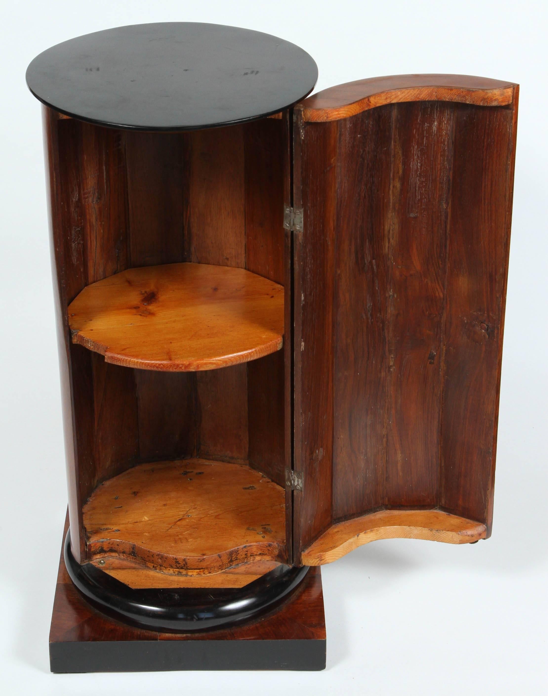 19th Century A Walnut and Ebonized Wood Biedermeier Cylindrical Pedestal Cupboard