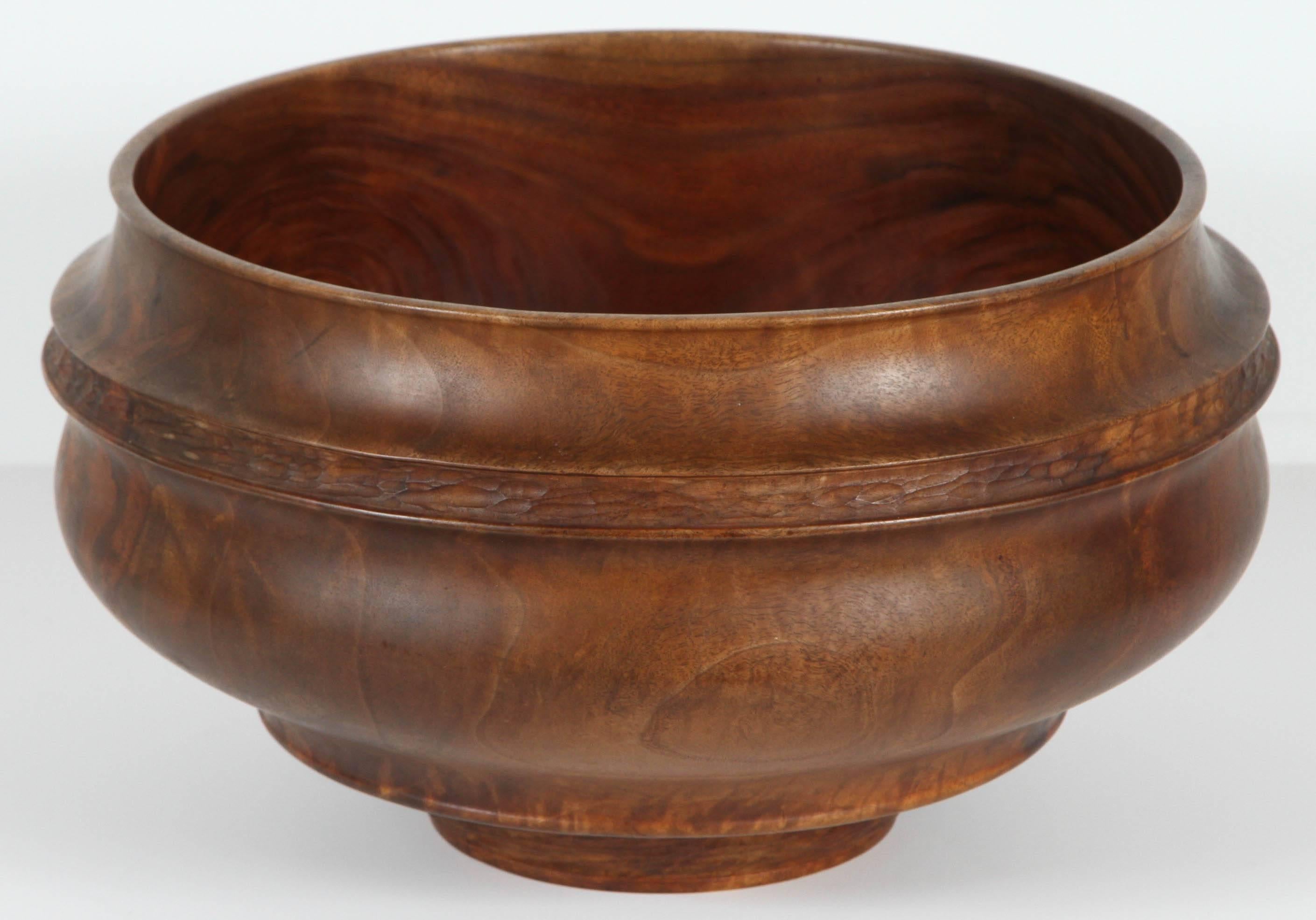 Great early Donald Saxby chip-carved black walnut bowl. Beautiful chatter texture around the collar and base (see detail images.) This example is featured on the cover of the catalog titled 