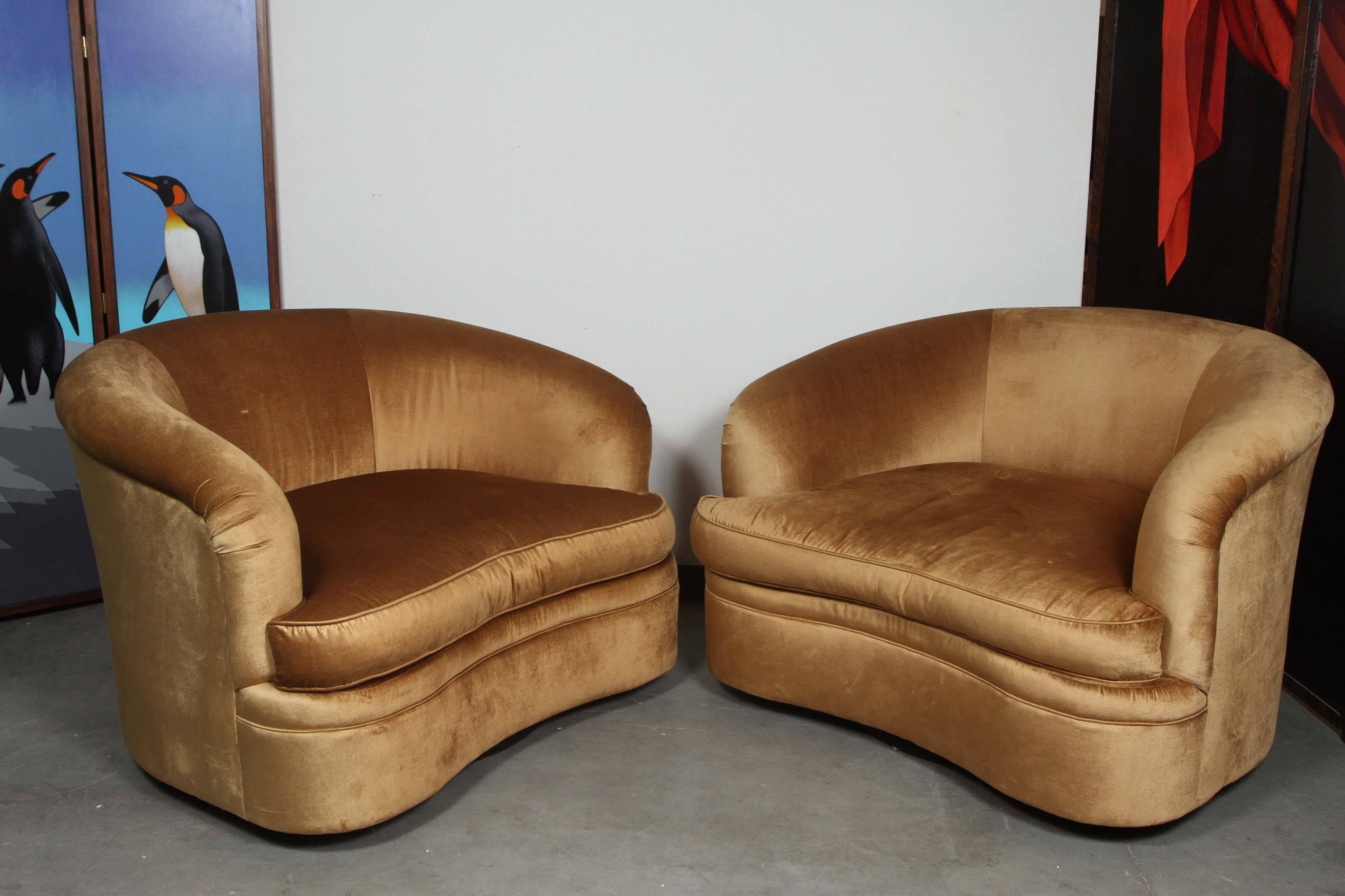 Pair of over scale club chairs by Century.
The chairs are upholstered in a gold velvet with copper overtones.
The matching ottoman is available as part of the set or may be purchased separately.

The price listed is just for the chairs.

