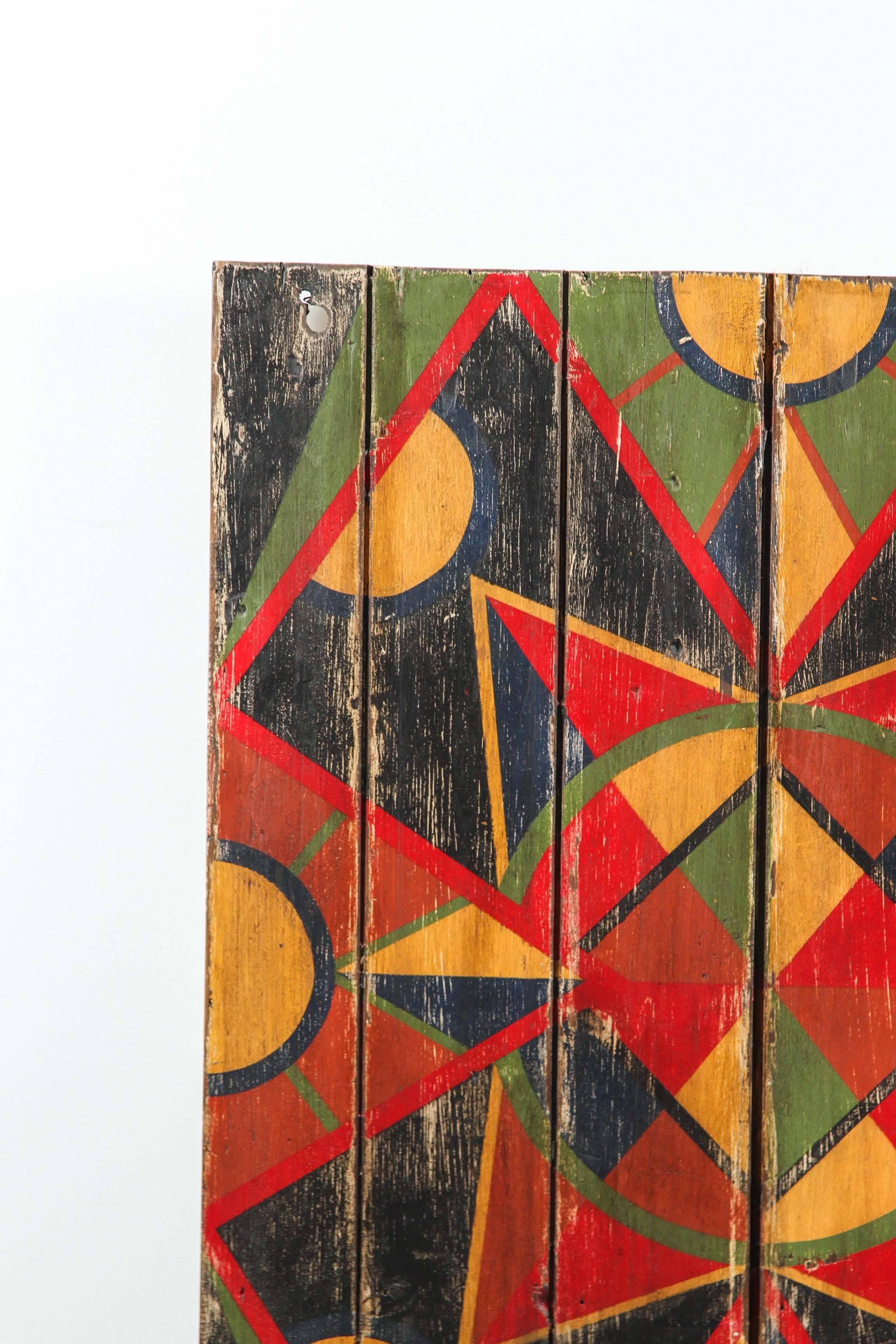 Bold geometric abstract board found in Texas. We have a collection of these boards from an anonymous artist. Painted on recycled cupboard doors, table tops, stool tops and bread boards. Very dynamic when hung in collections.

This board was