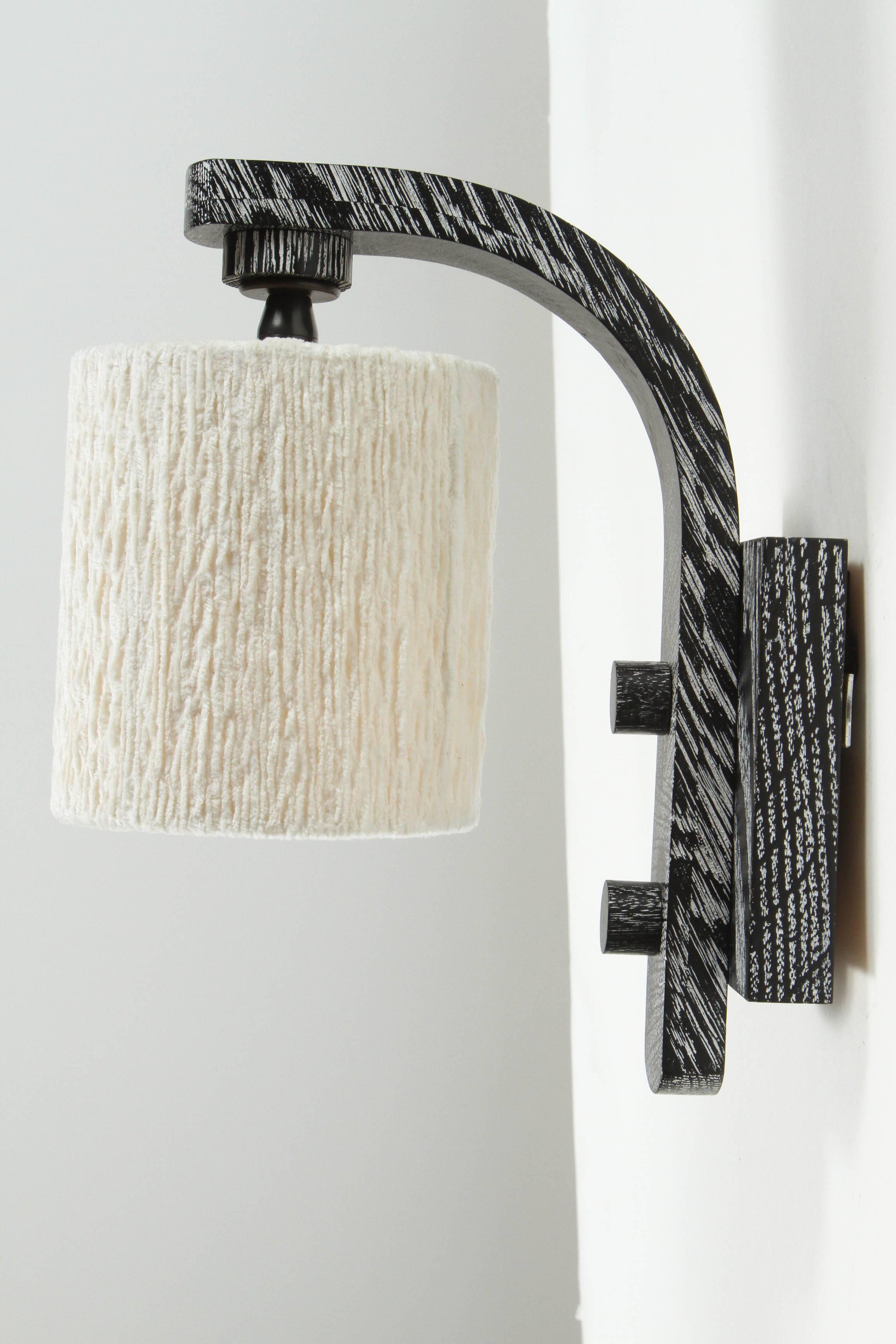 Paul Marra Oak Sconce in ebony finish with cotton chenille shade. By order.

Back plate 4in.W x 4.75in.H, diameter of shade is 4.5in.W; overall dimensions are 4.5in.W x 8.5in. projection x 10.25H.

 