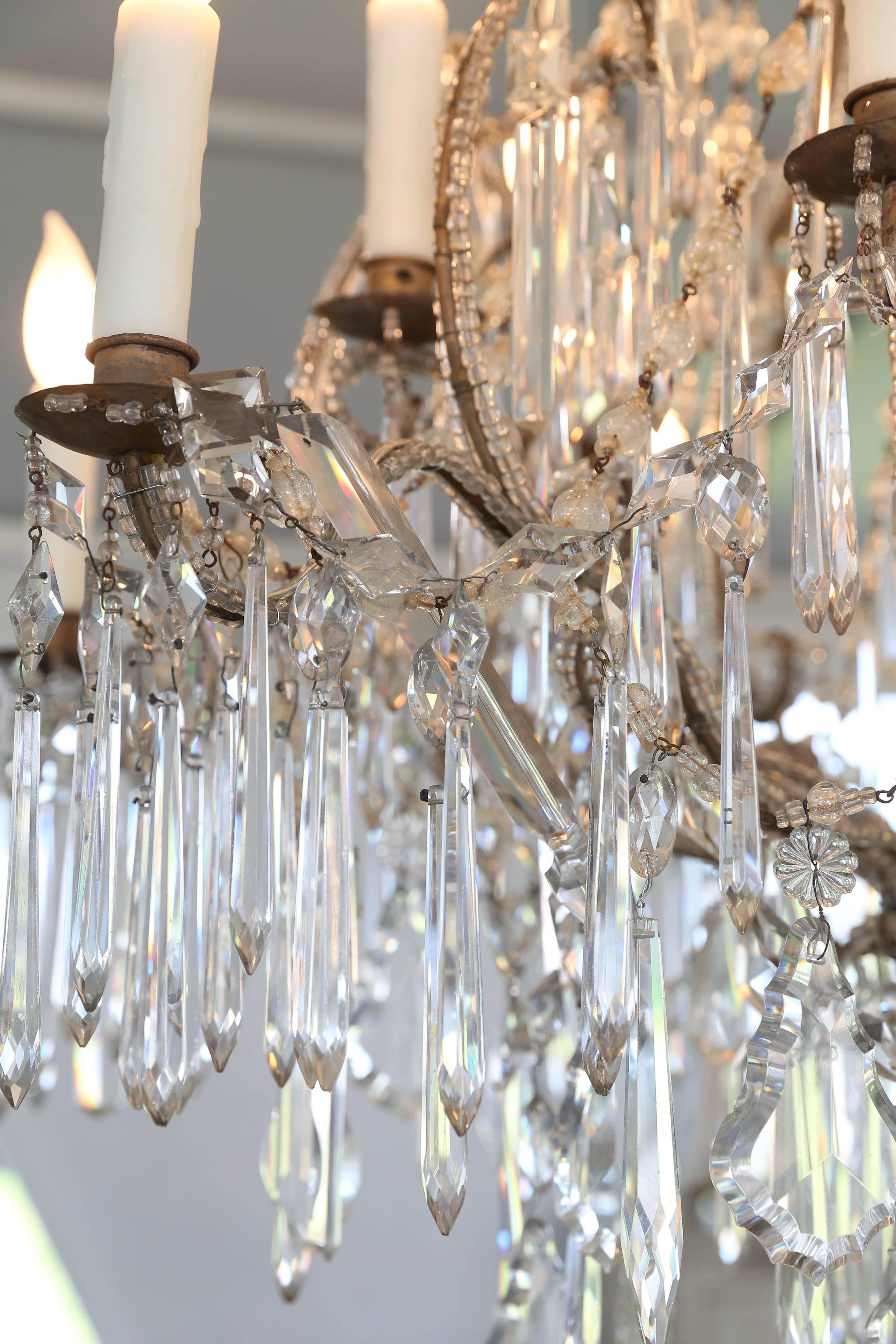 This is an absolutely breathtaking chandelier in person. It is full of crystals and has been newly wired for USA standard. It does have minor loses of missing crystal but doesn't at all take away from it's beauty. It Italian at it's best.