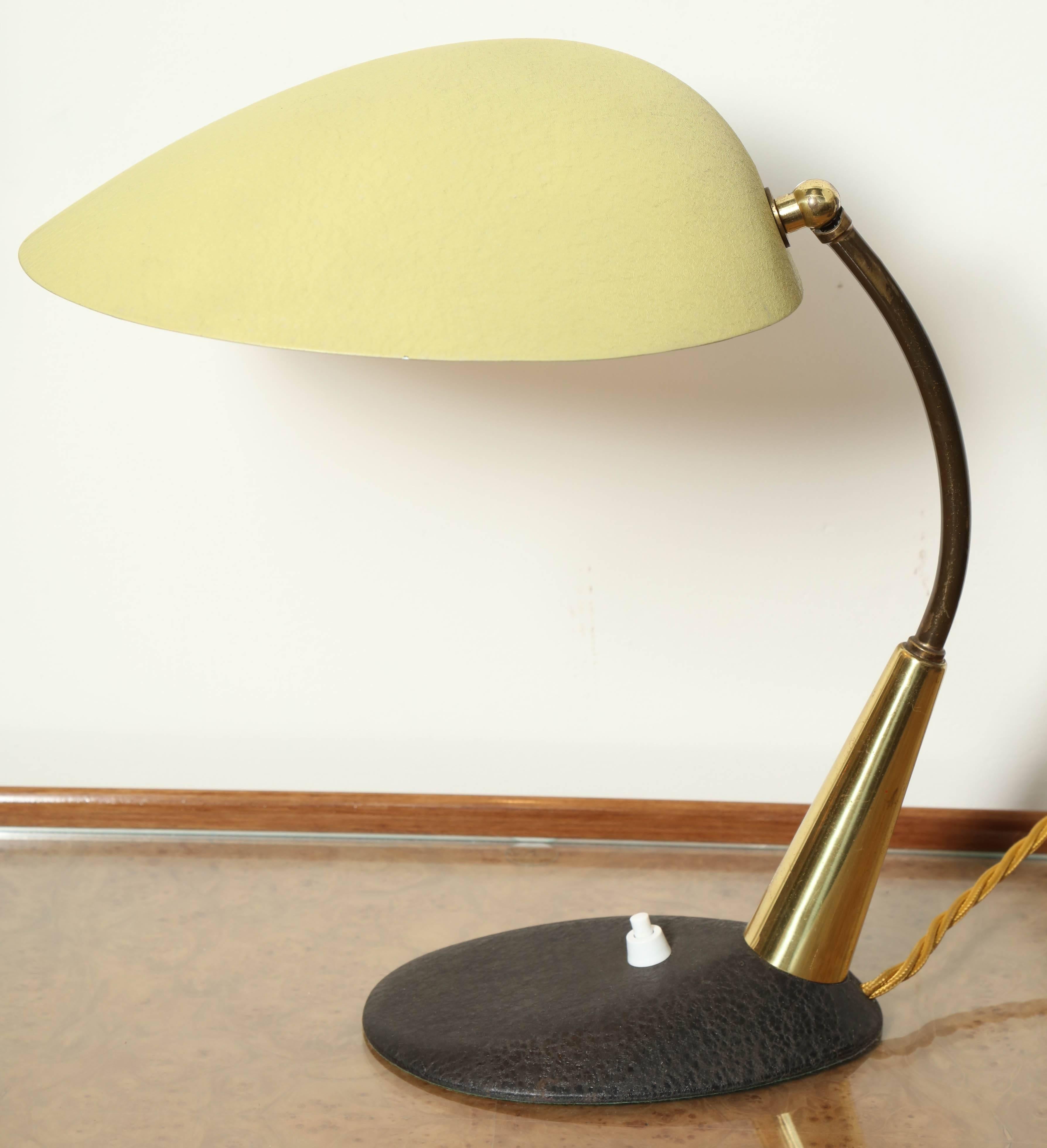 Modernist desk lamp made in Milan by Stilnovo in 1955, bright lemon yellow shade, does not show in this photo. Shade and base has a stippled surface. Adjustable shade.
