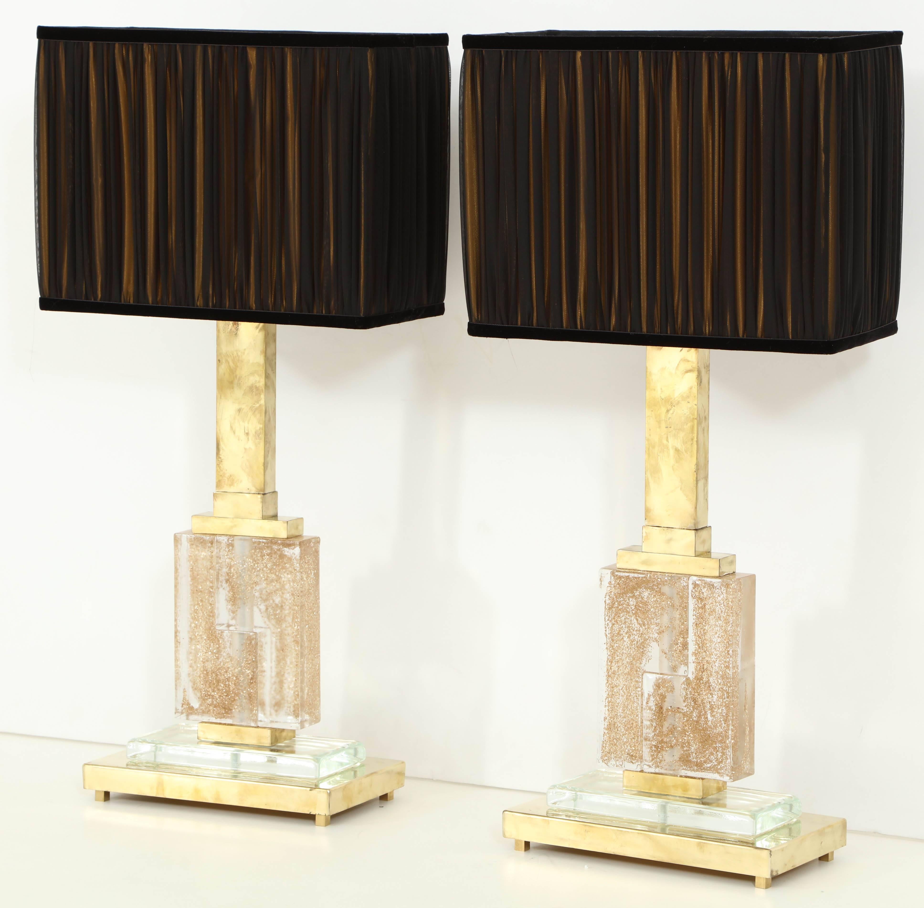 Exquisite craftsmanship and composition make these vintage Italian lamps a true work of art. Handblown in clear Murano glass with infused gold sparkles and brass base, each lamp stands 33 5/8