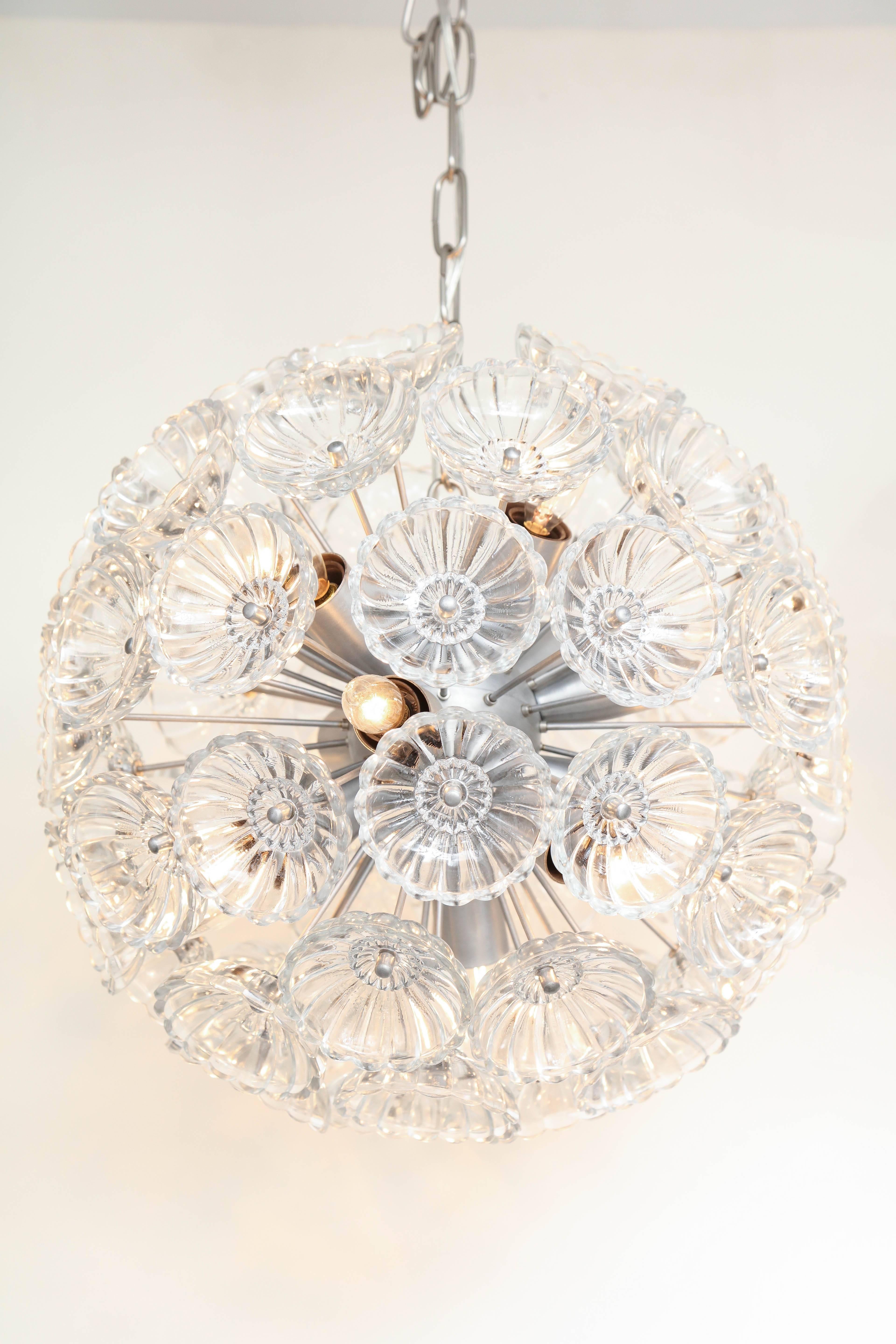 Mid-Century Sputnik chandelier with stylized glass flower elements on a brushed nickel frame. Rewired for use in the USA. Currently a pair is available.