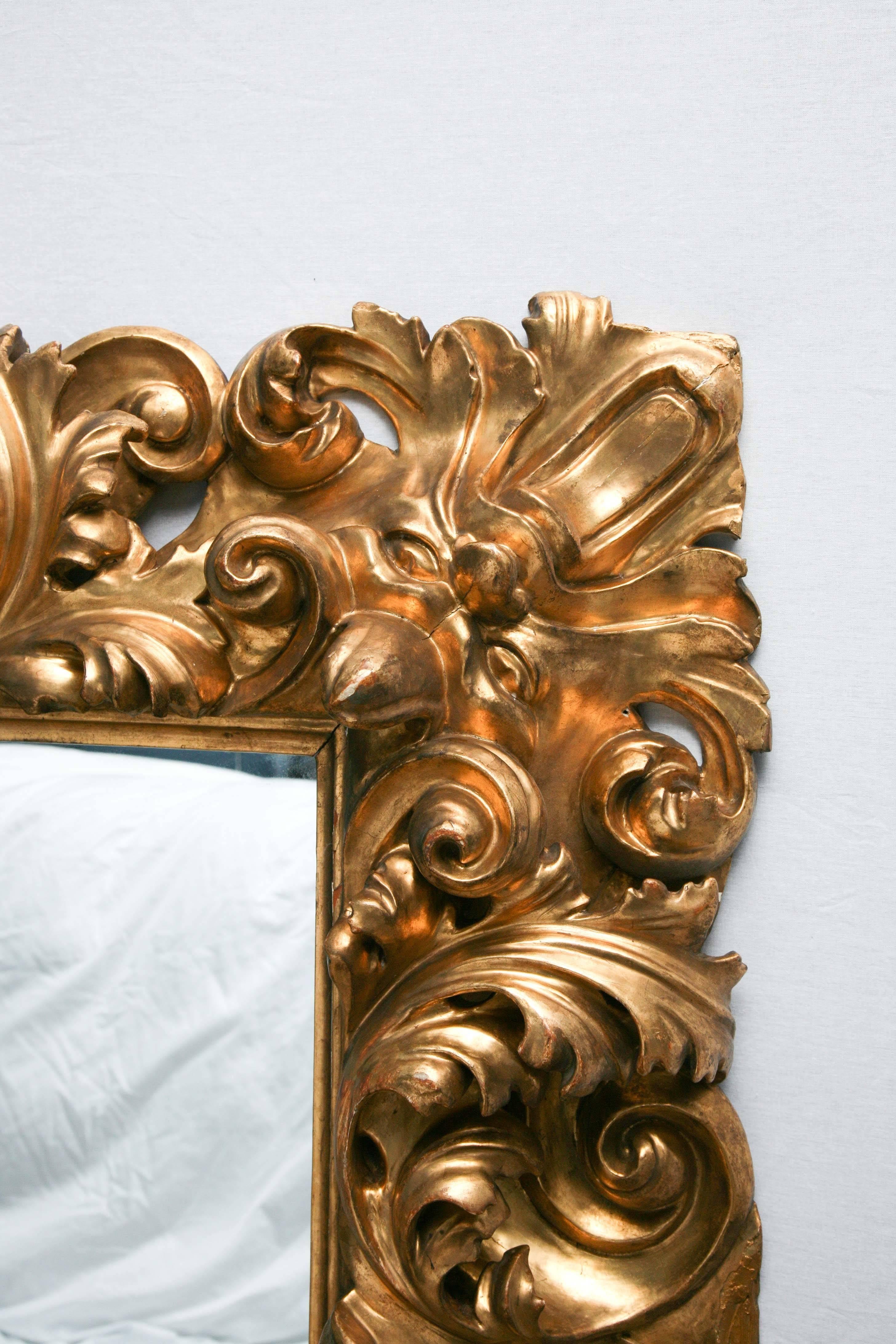 18th Century and Earlier Italian Baroque Carved Giltwood Mirror, 18th Century