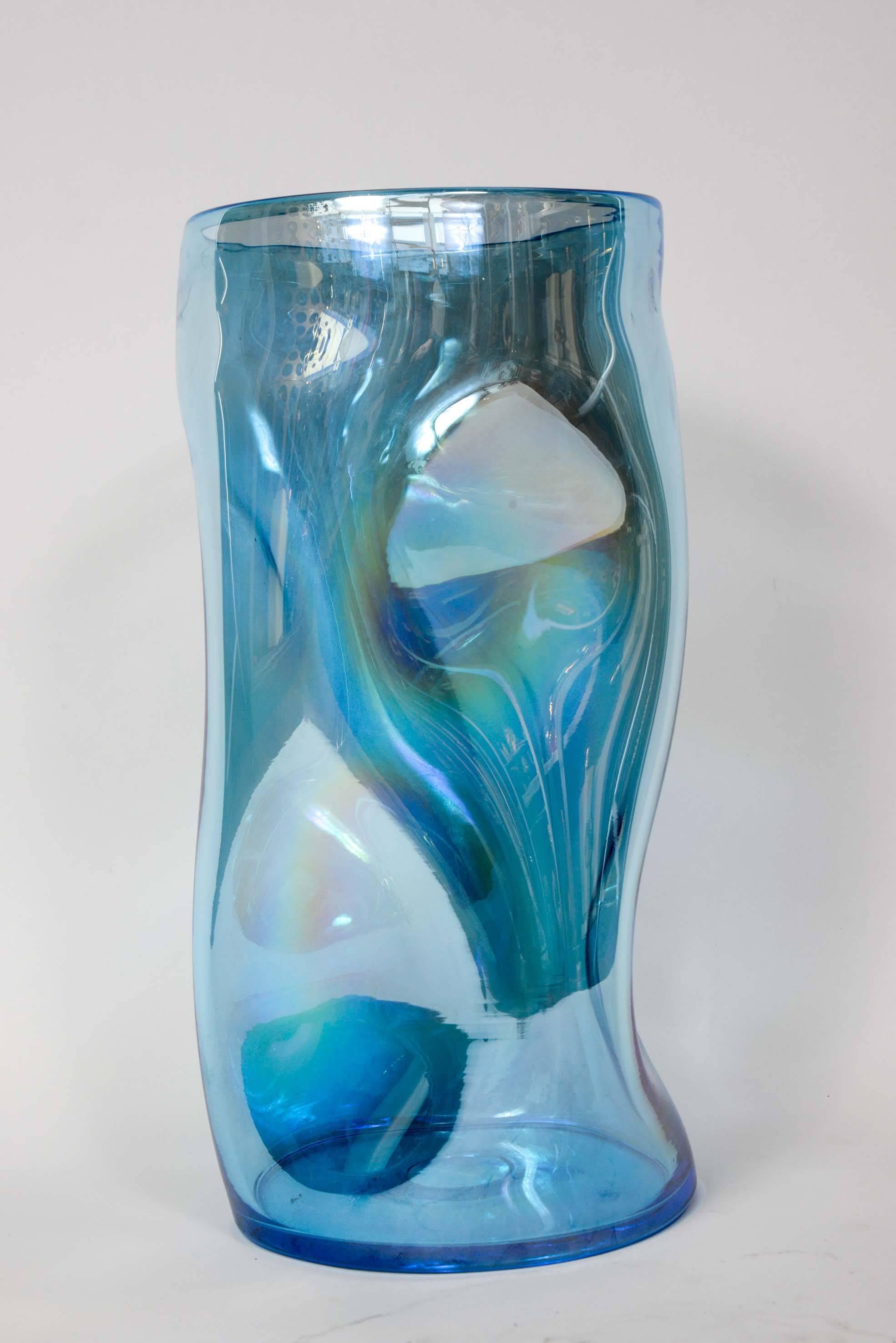Pair of unusual vases made of Murano glass, with their free-form shape and iridescent coating.

 