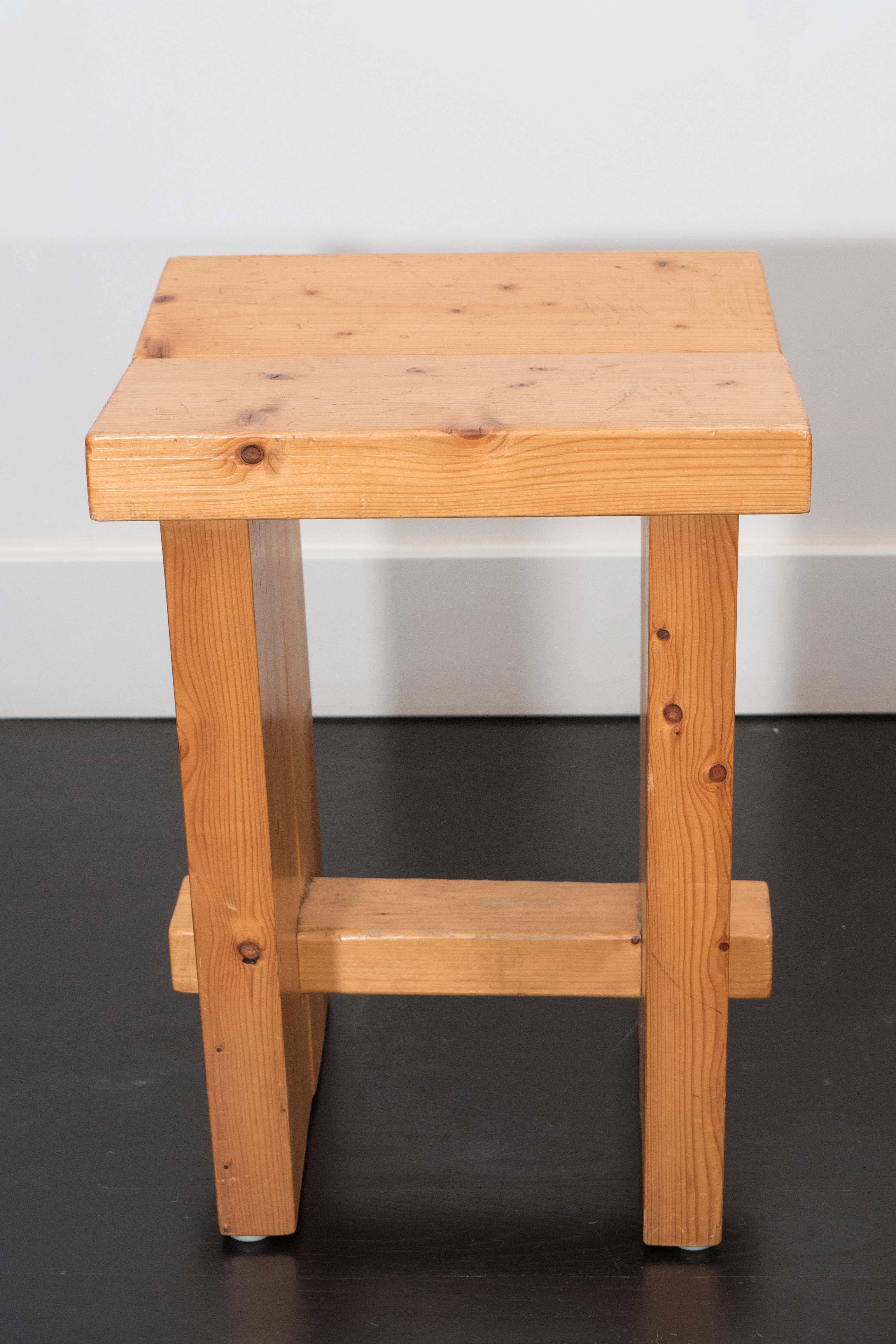 A pair of pine stools in the style of Perriand. Natural finish and dowel assembly.
