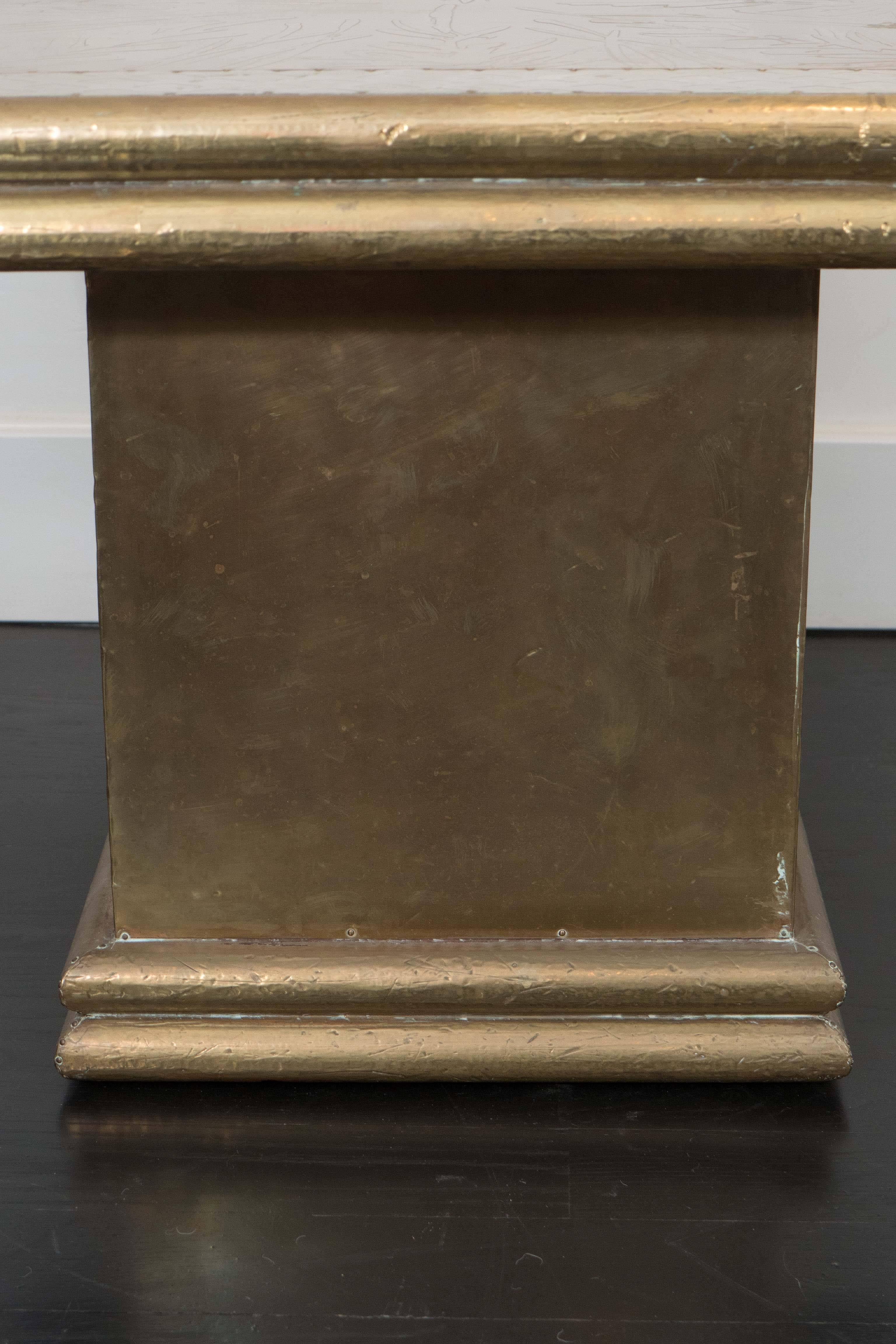 Elegant brass side table by Rodolfo Dubarry, etched and hammered panels.