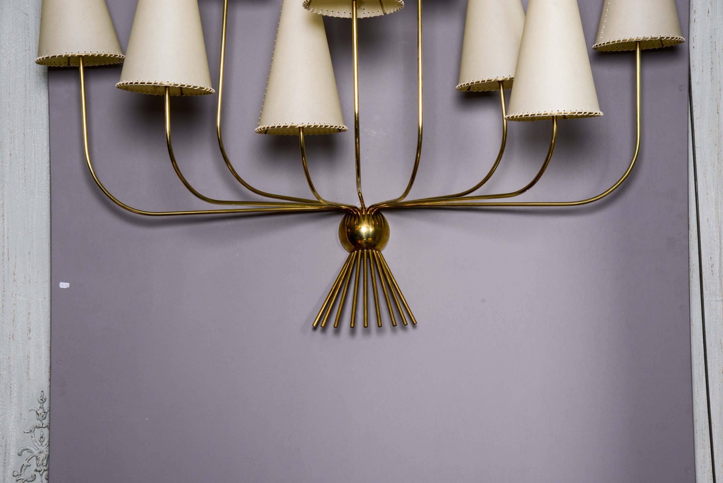 Pair of brass and parchment lamp shade sconces, nine arms.