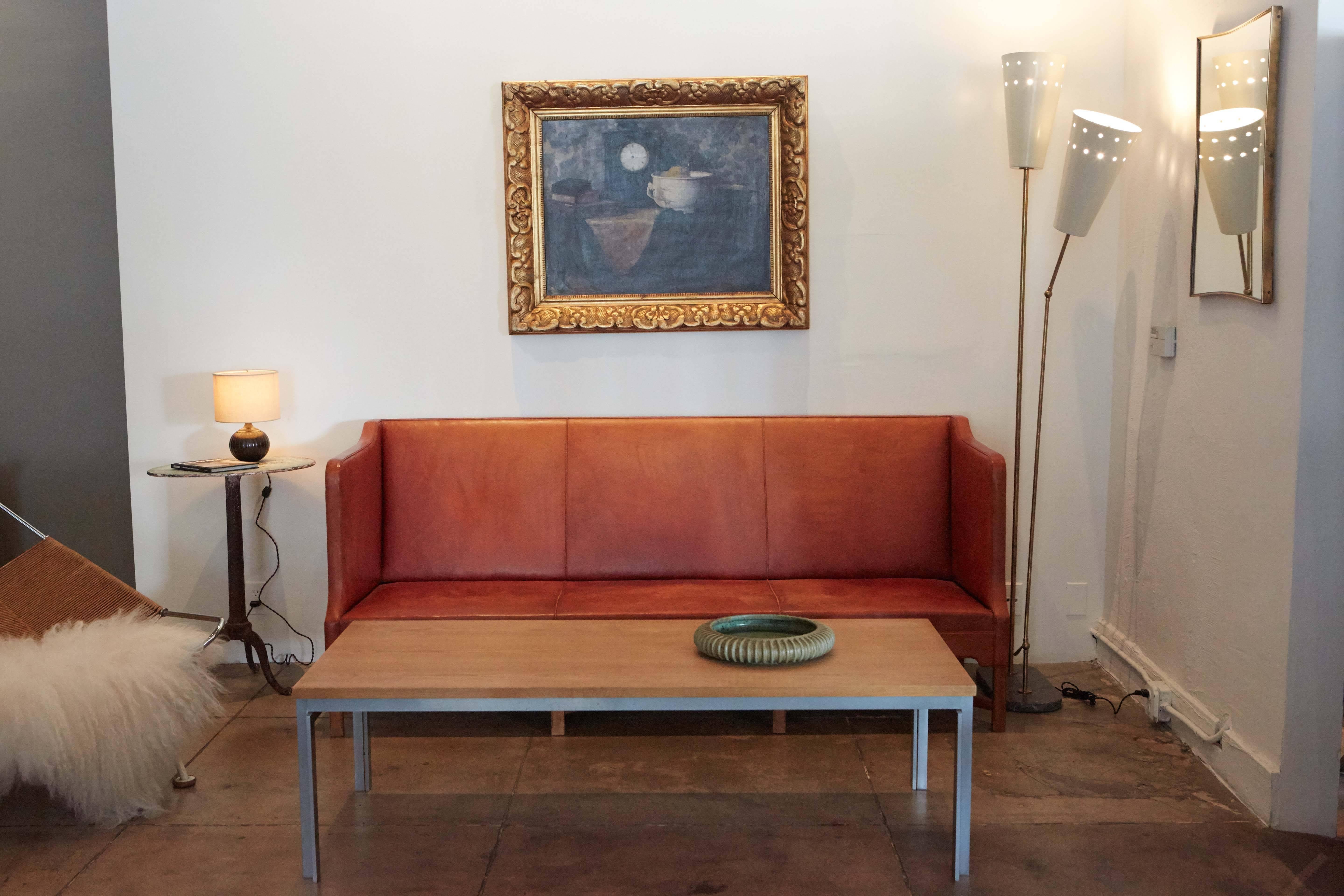 Klint's iconic sofa with original patinated leather and Cuban mahogany frame.