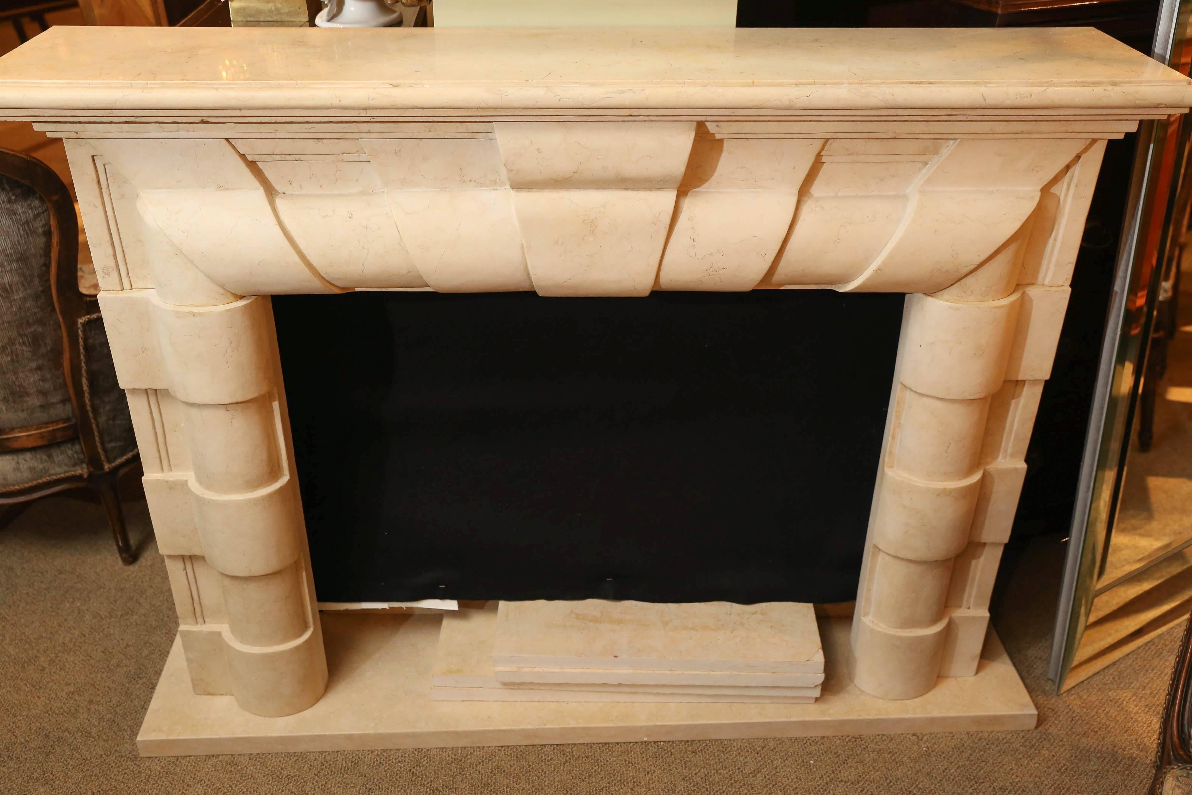 Contemporary marble mantle in cream marble
hand-carved.