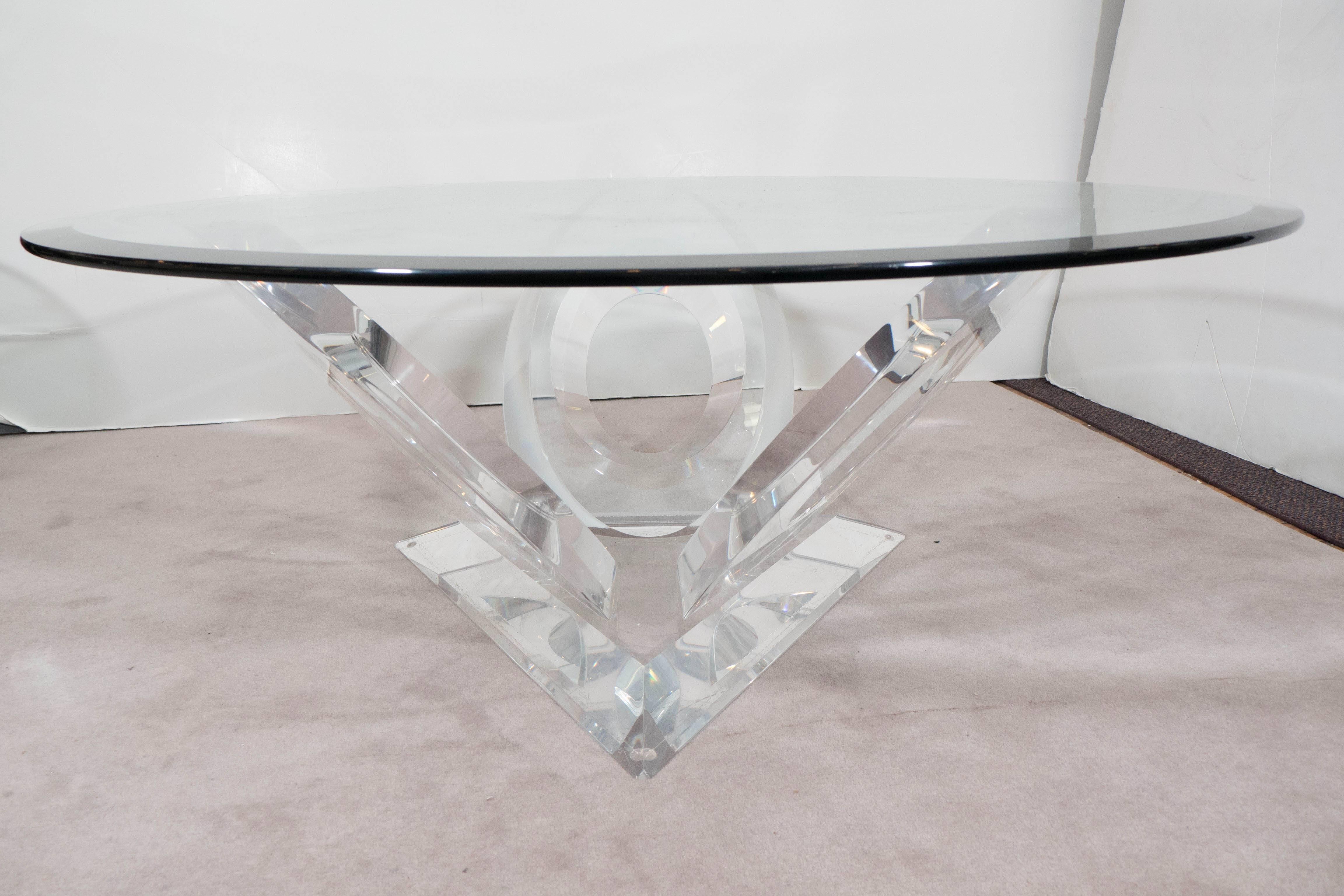 A coffee and cocktail table by Mikhail Loznikov, with glass top on sculptural base, composed of looped Lucite. Markings include [