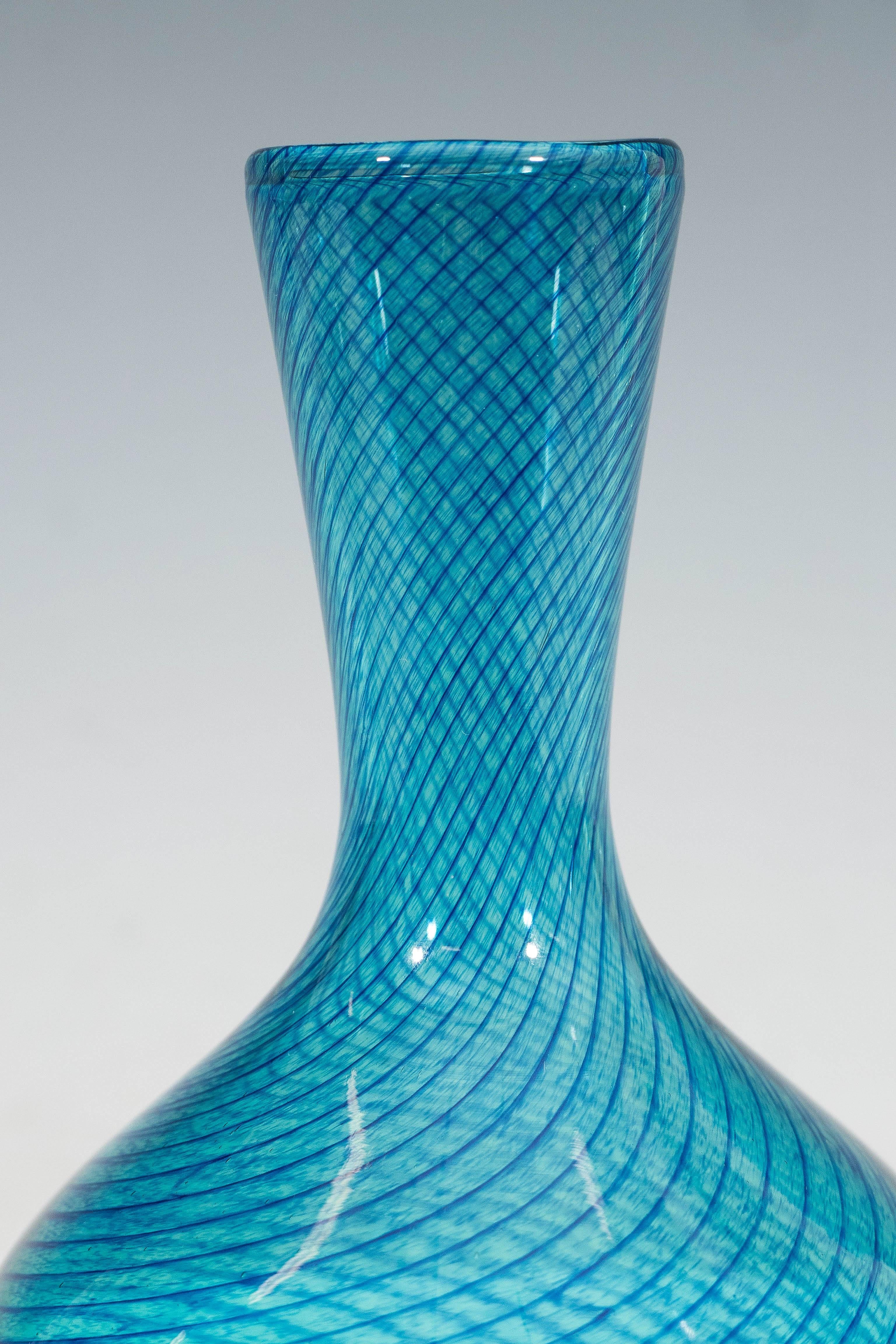 A vintage Norwegian blue blown glass vase, by Willy Johansson for Hadeland Glassworks, in baluster form, with mottled indigo swirls. Markings include [Hadeland], etched to the base. Very good condition, with minor wear to the underside, consistent