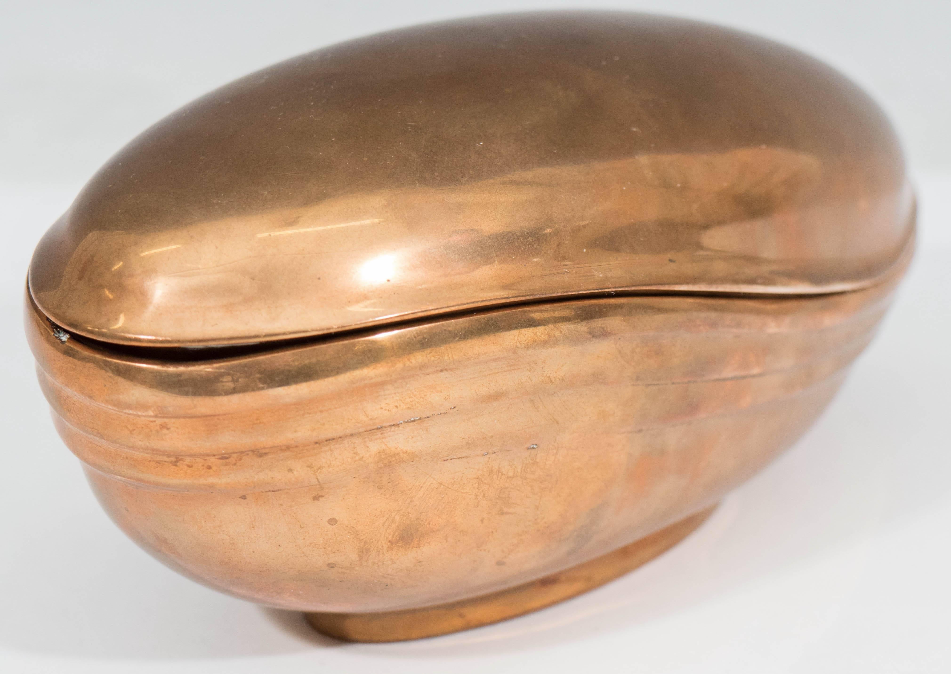 An Italian rounded covered decorative bowl in heavy bronze, produced circa 1980s by artist Esa Fedrigolli. Markings include the artist's signature [Esa Fedrigolli] and label [Esart/Made in Italy] to the bottom, as well as additional label to the top