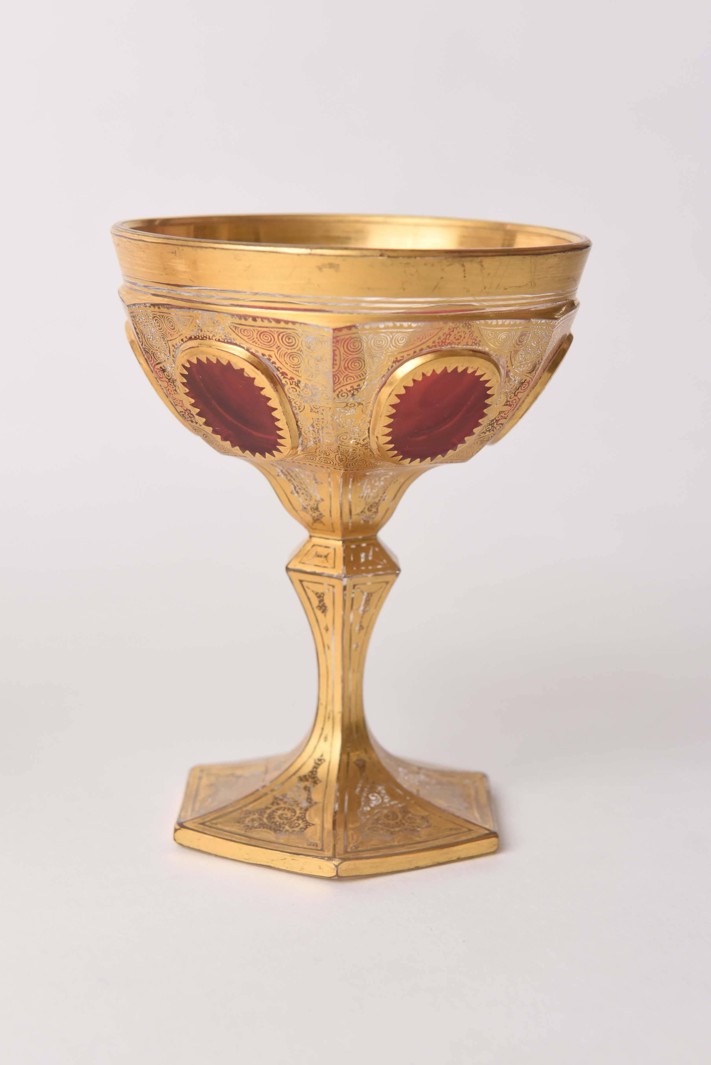 An exceptional set of free blown and hand detailed champagne coupes from Moser, The Glass of Kings. These feature a delightful chalice shape with a shaped and cut stem and base. The bowl of the champagne has carved ruby cabochon jewel styling and a