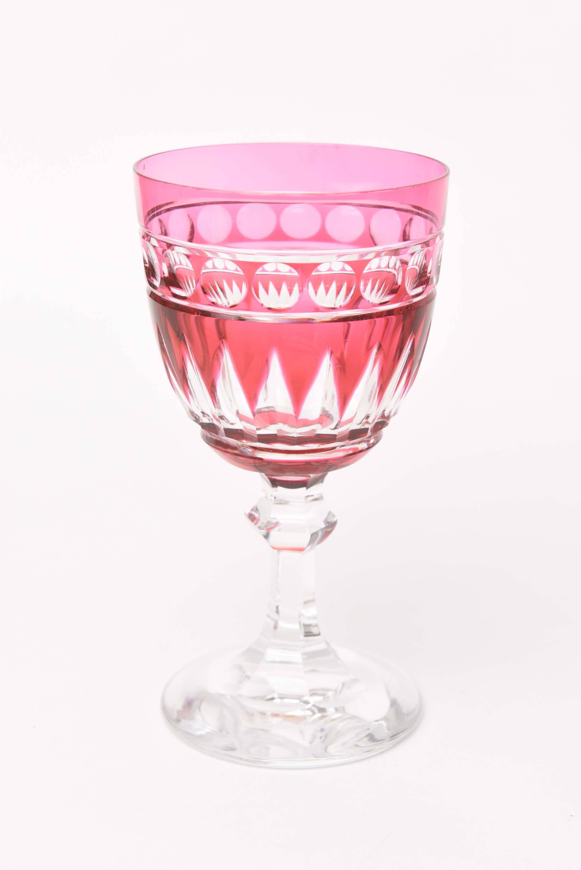 From the fine crystal firm of Val Saint Lambert Belgium we have a set of 12 tall and well-proportioned goblets for water or red wine. Cased and cut to clear with an elongated thumbprint and partial diamond motif. A mid knob stem so it handles and