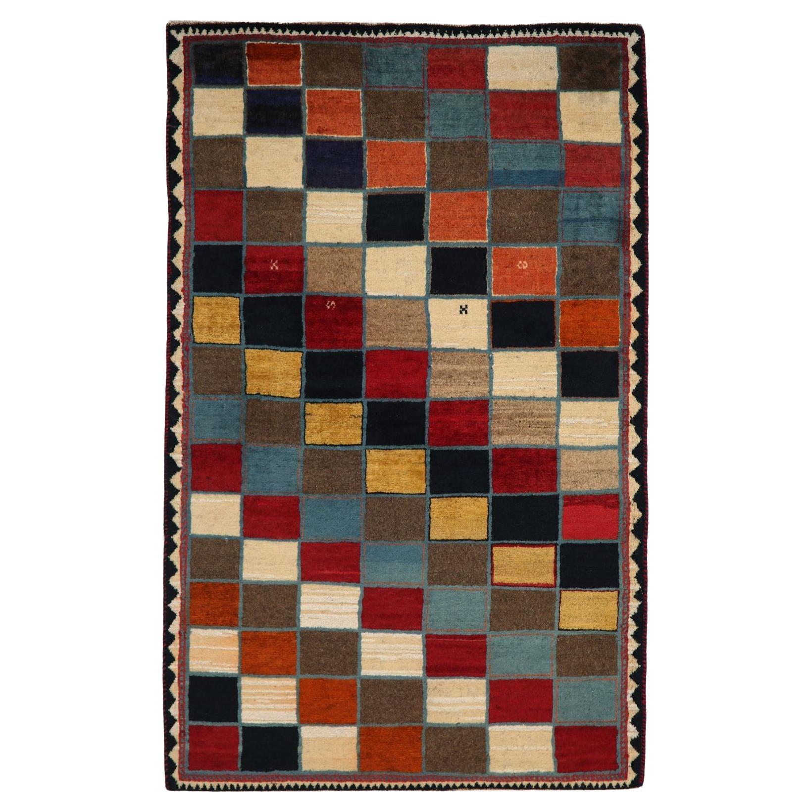 Modern Artistry, Ancient Roots: 
A Vibrant Persian Gabbeh Wool Rug
A Kaleidoscope of Contemporary Design
Immerse your space in the unique blend of ancient tradition and bold modernity with this exquisite Persian Gabbeh wool area rug. Originating