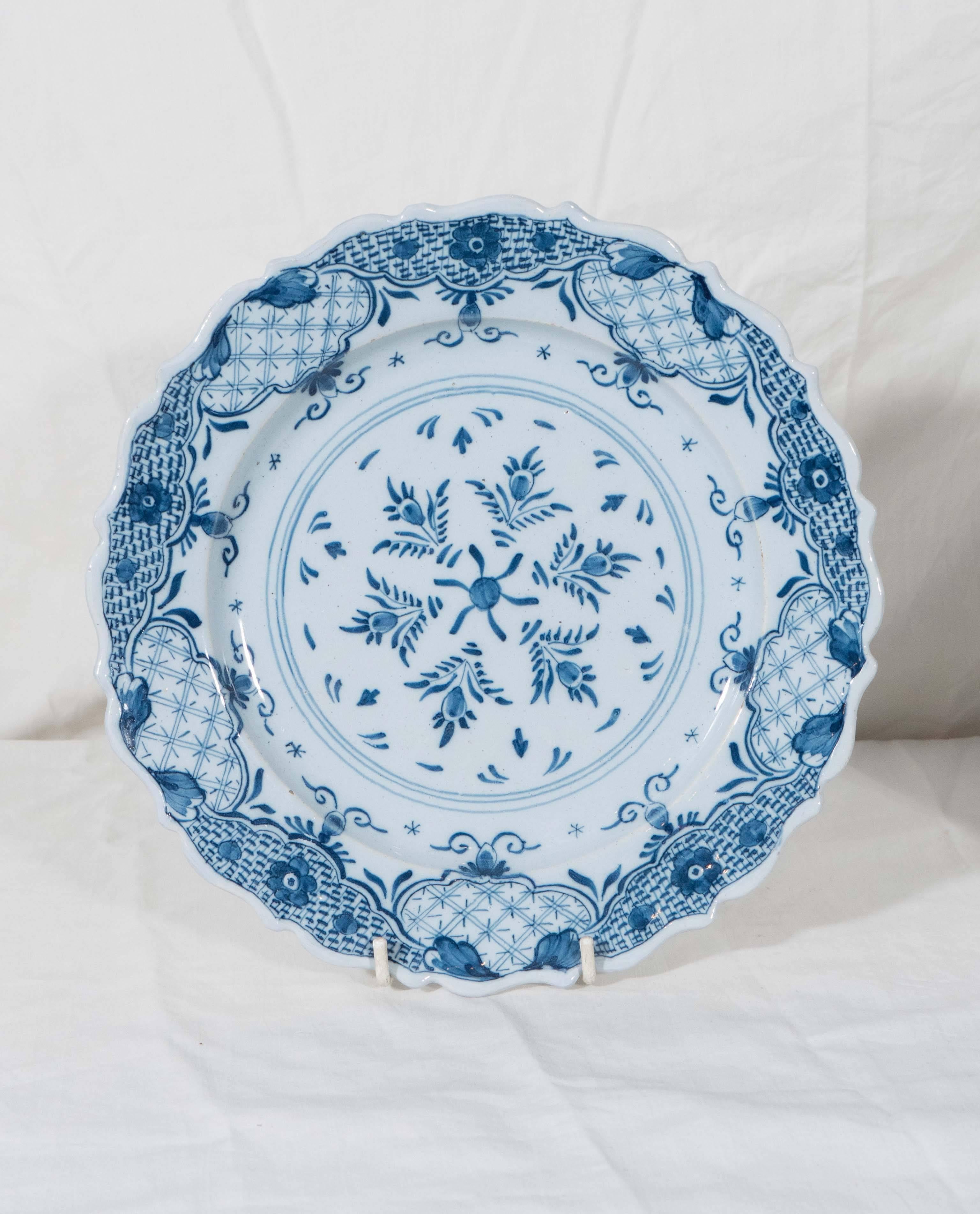 Made between 1763 and 1777 the dishes have the mark "Duijn" for Ysbrand van Duijn" owner of De Porceleyne Schotel. They are painted in soft tones of
cobalt blue. The center of each dish shows a star shape formed by six tulips. The