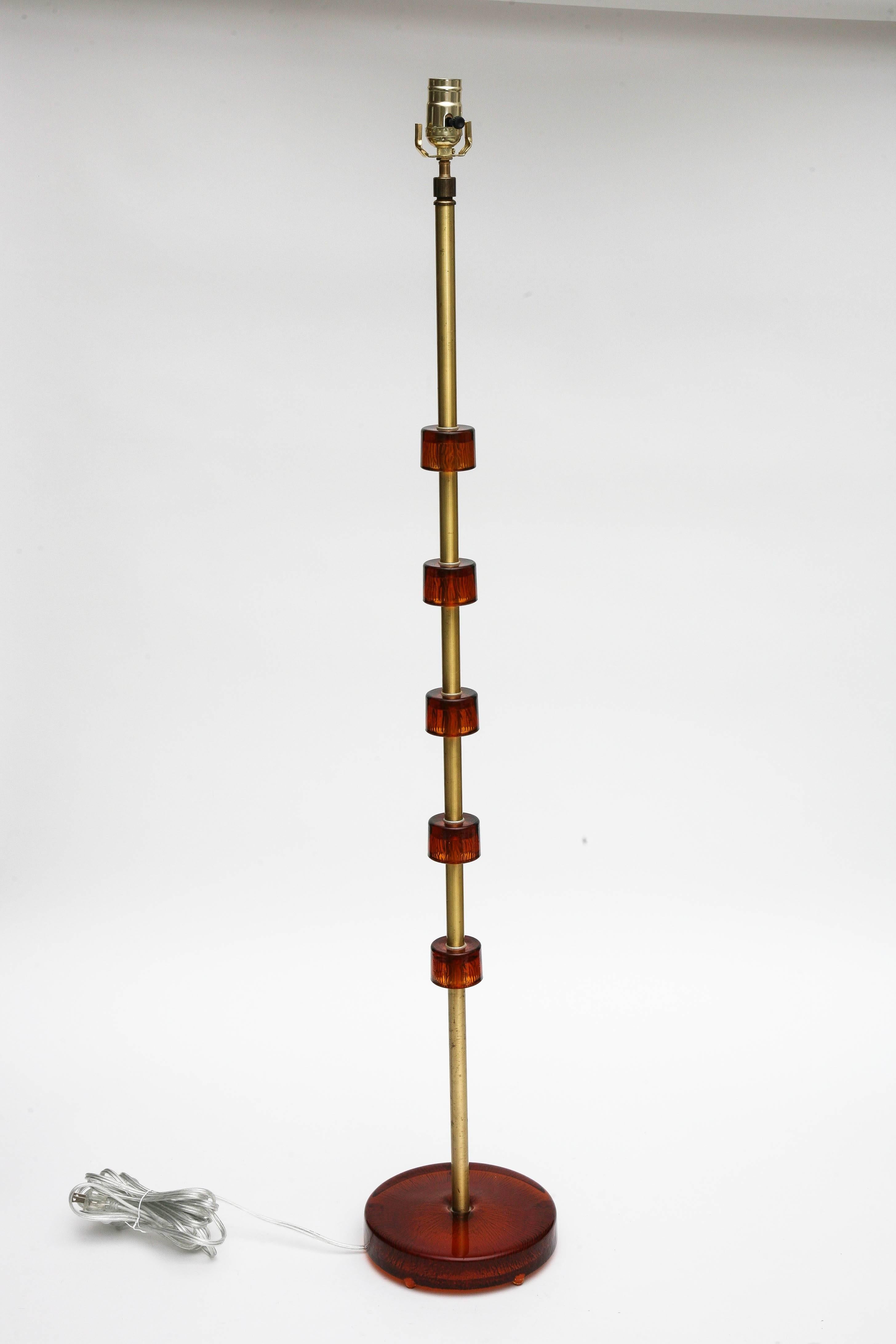 Carl Fagerlund floor lamp with brass stem, mounted handblown amber color
crystal discs, by Orrefors. Swedish Wired to US standard.
Measures: 55 in H (with harp) x 8 in round base.