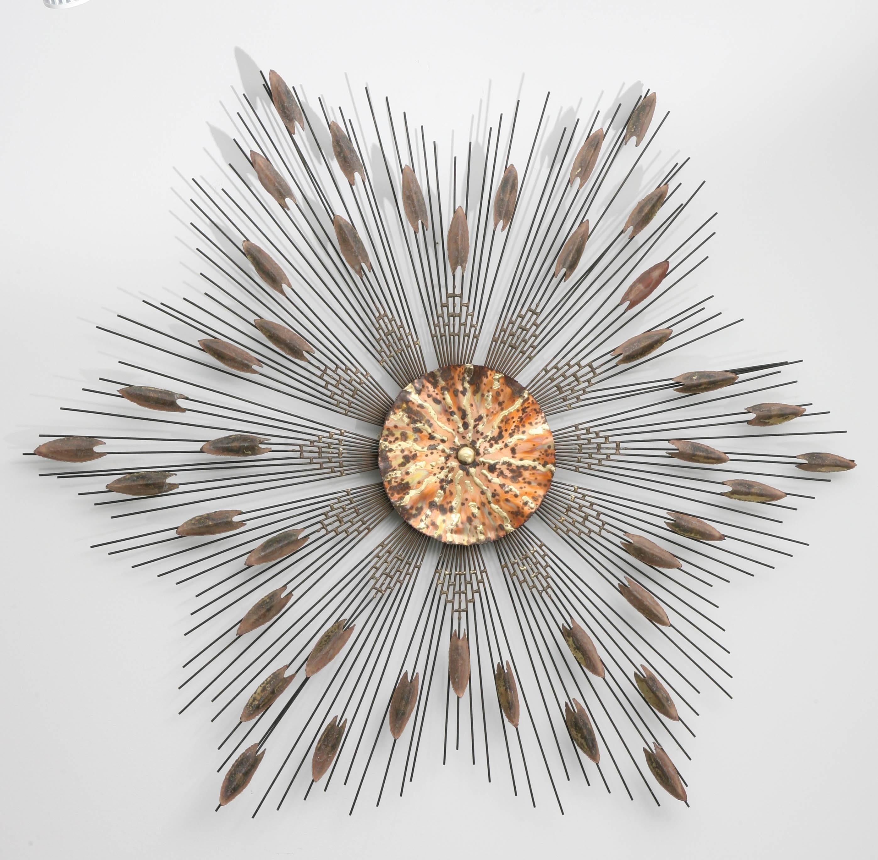 This handsome six-point star, wall-hung sculpture is very much in the style of pieces created in the Mid-Century by Curtis Jere. The piece is fabricated of steel, burnished brass and copper.

For best net trade price or additional questions