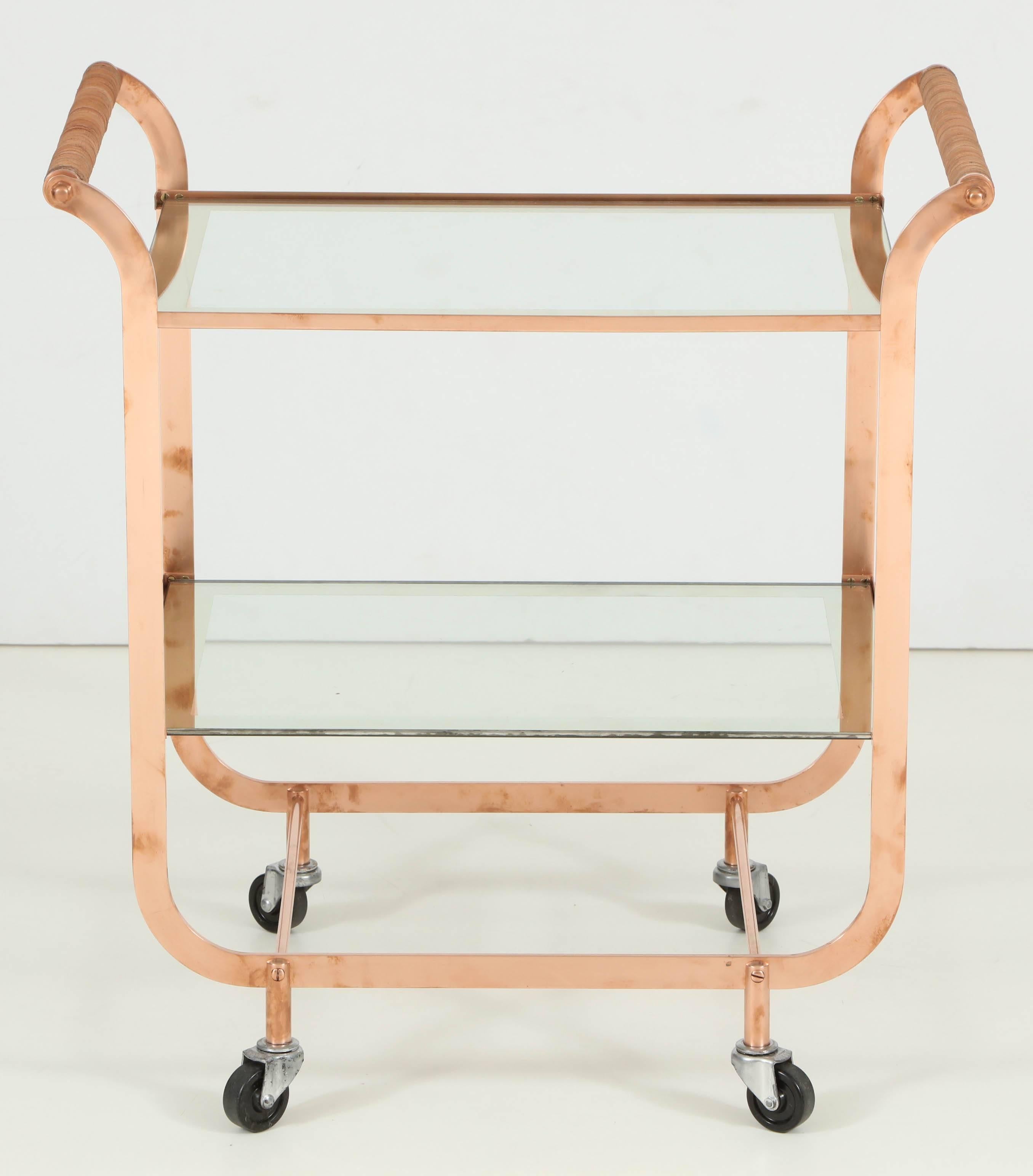Copper bar cart from France, circa 1950. Glass has silver edges.
