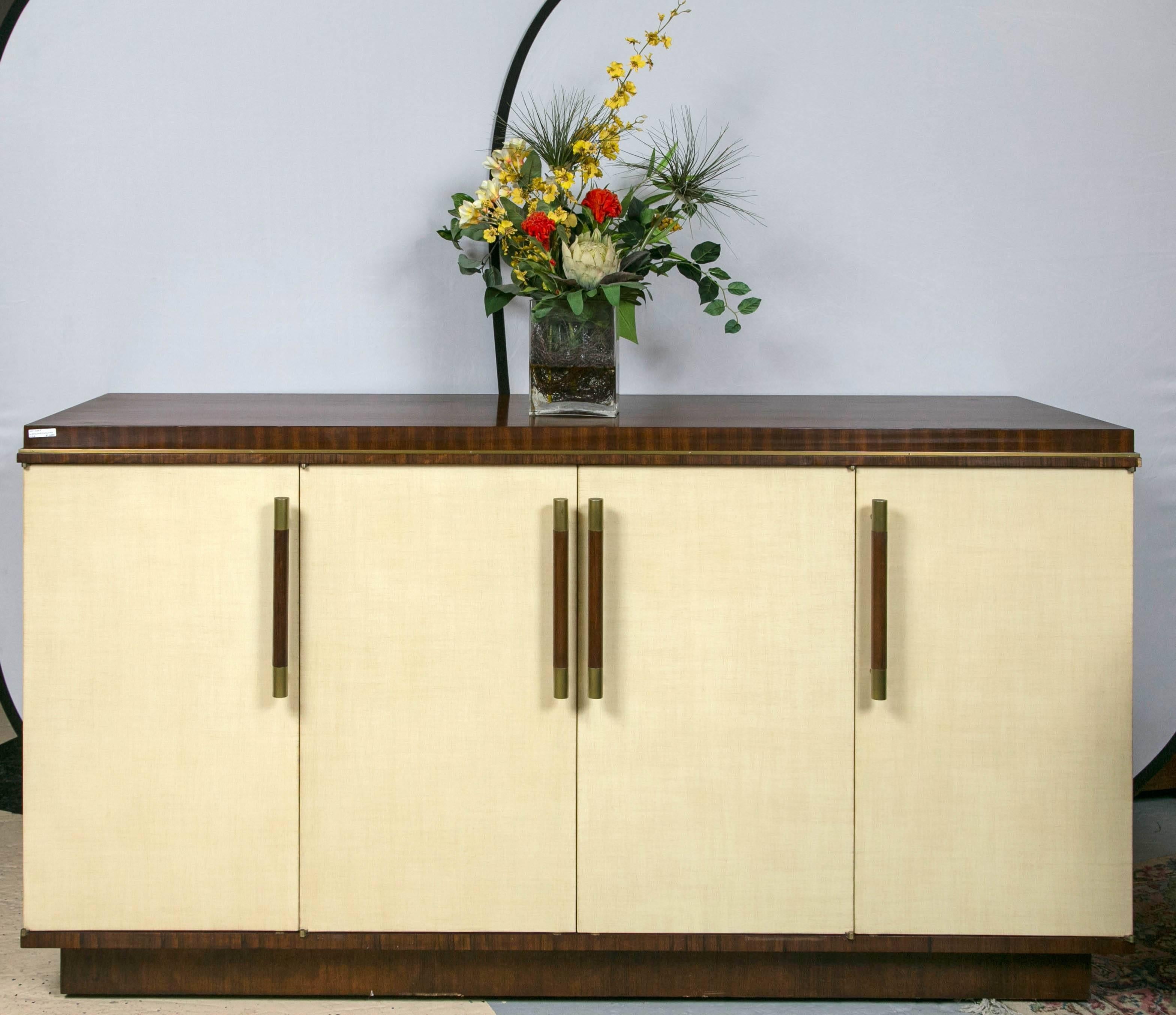 Jonathan Charles buffet sideboard rosewood and parchment. A fine handcrafted sideboard by one of the hottest designers in the country. The four parchment style doors with rosewood pulls having upper and lower brass caps leading to a fitted and