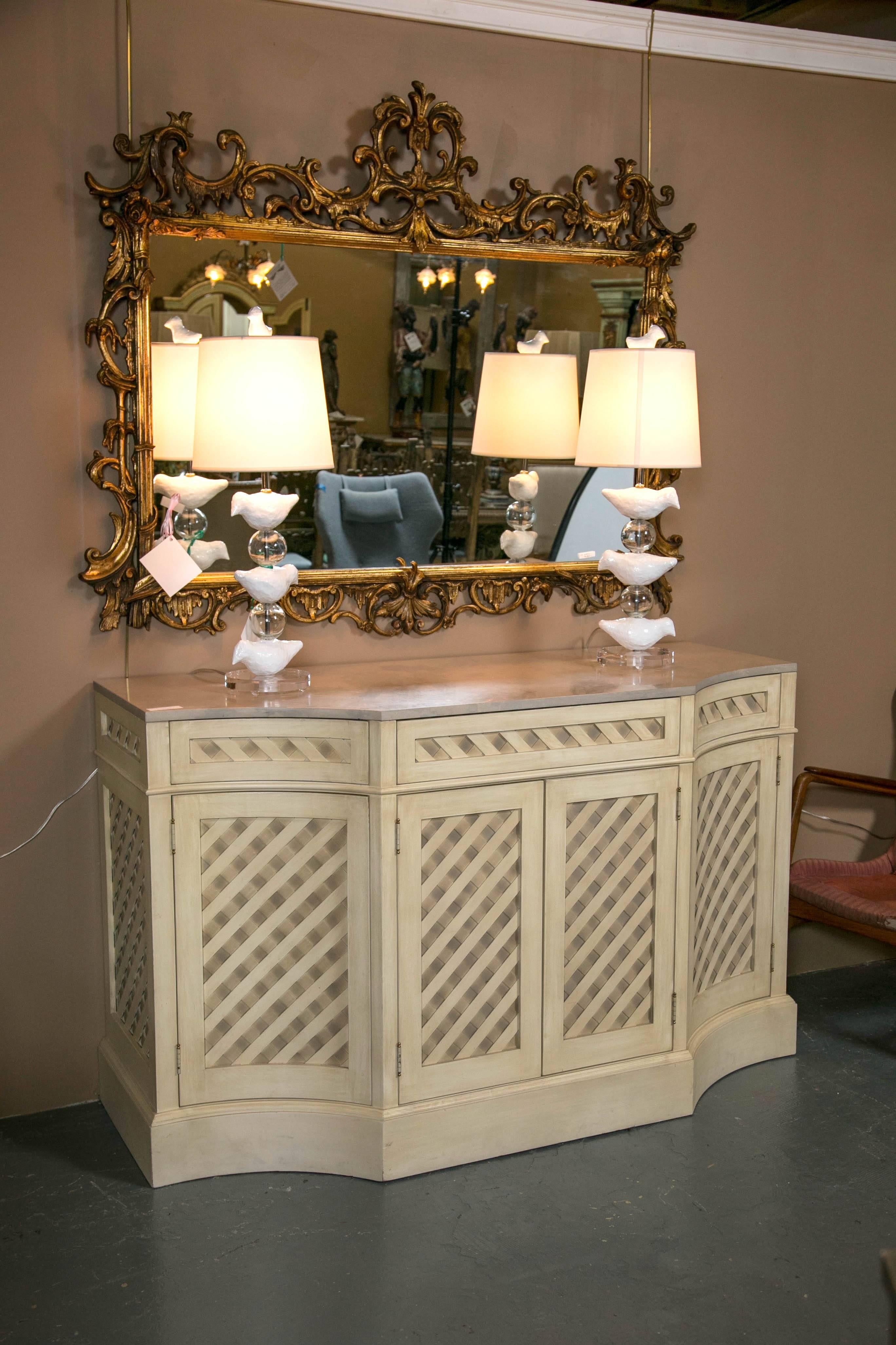 Designer marble-top painted checkerboard sideboard. Custom quality at its finest. This is a solid wood, through and though, custom sideboard. The concaved corner front flaking a pair of flat doors all leading to a finished single shelf interior. The