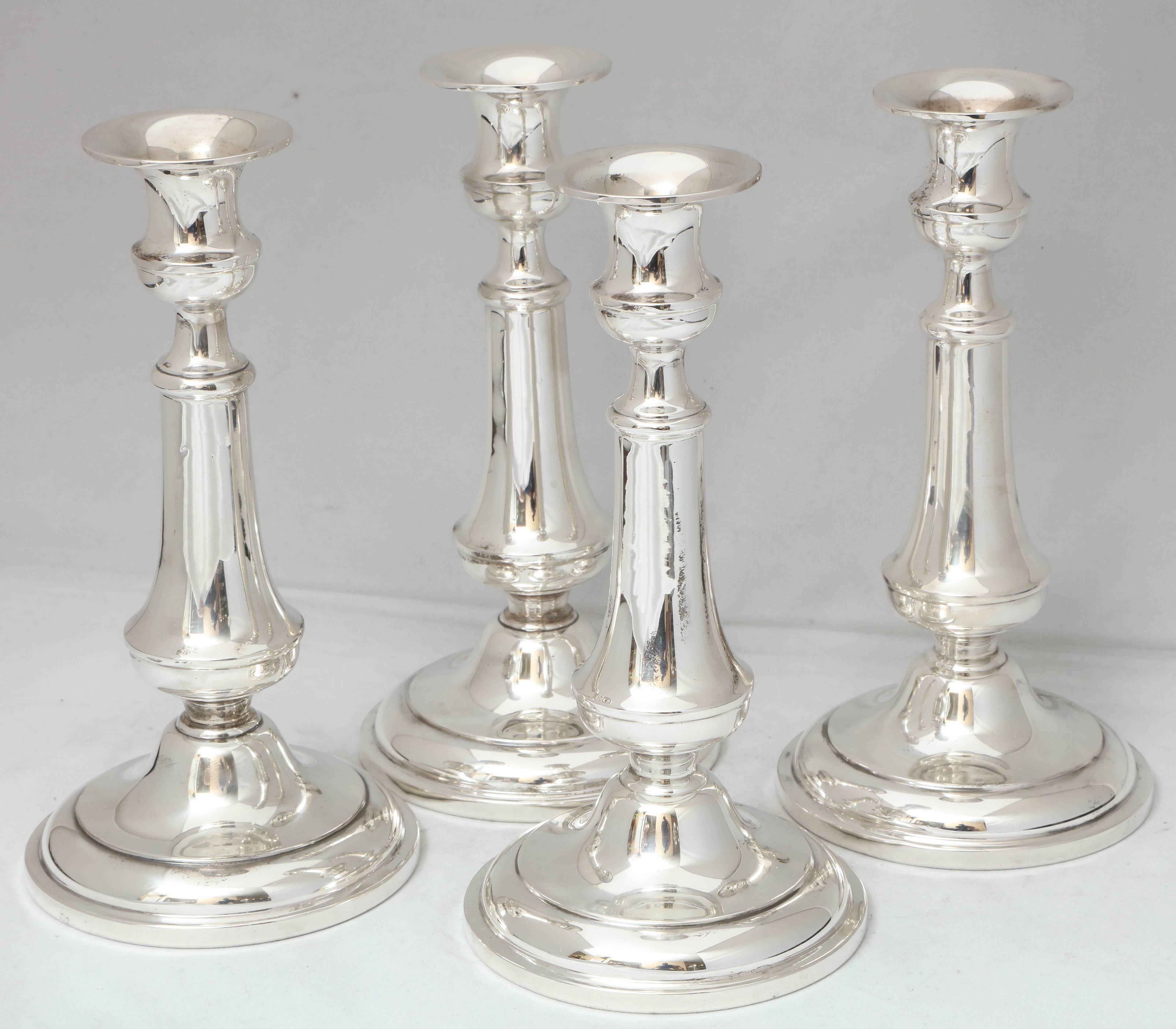 Beautiful suite of four, Edwardian sterling silver candlesticks. The Richard Dimes Company, South Boston, Massachusetts, circa 1910. Measures: 7 1/2