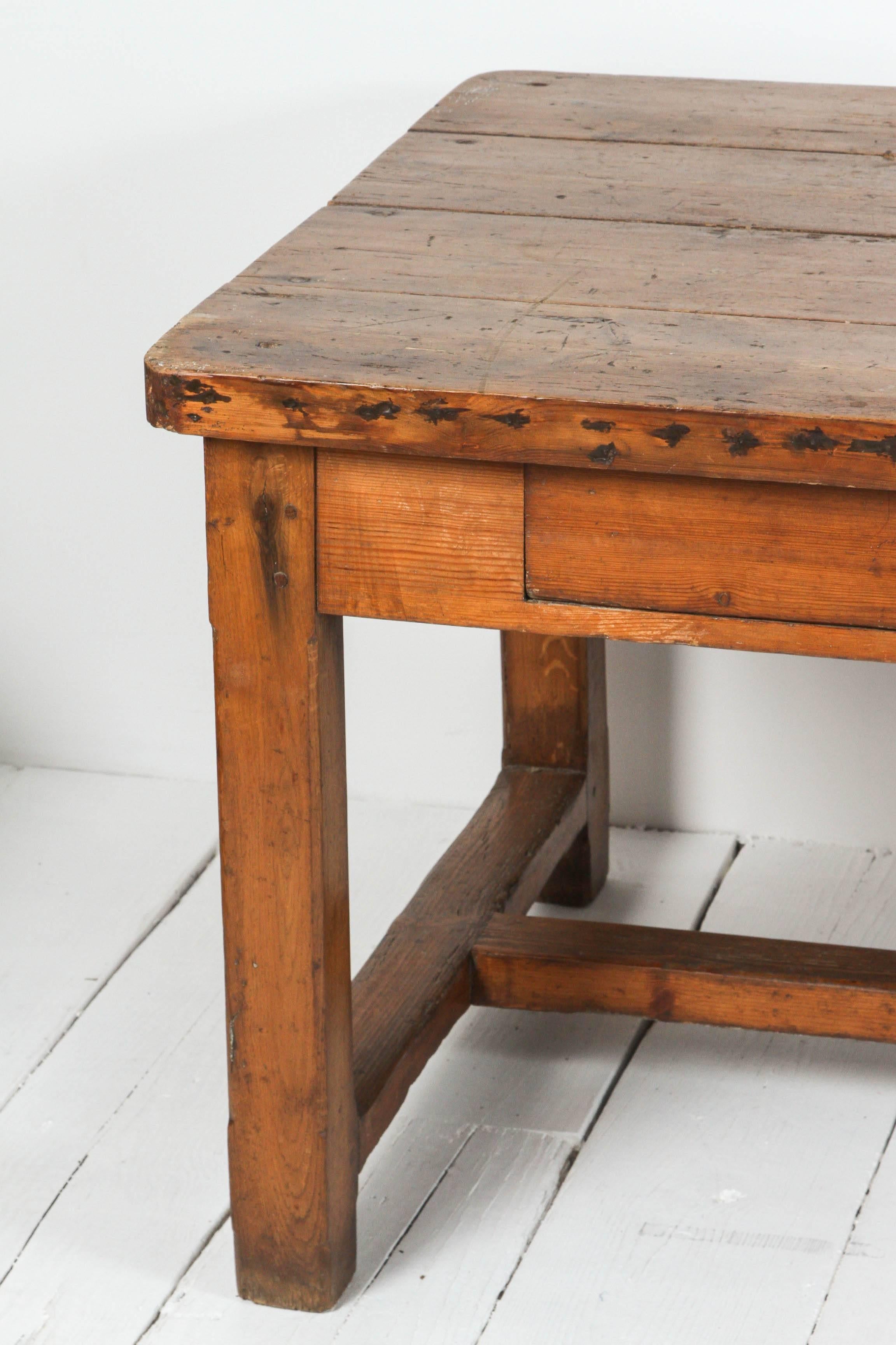 French farm table with two drawers.