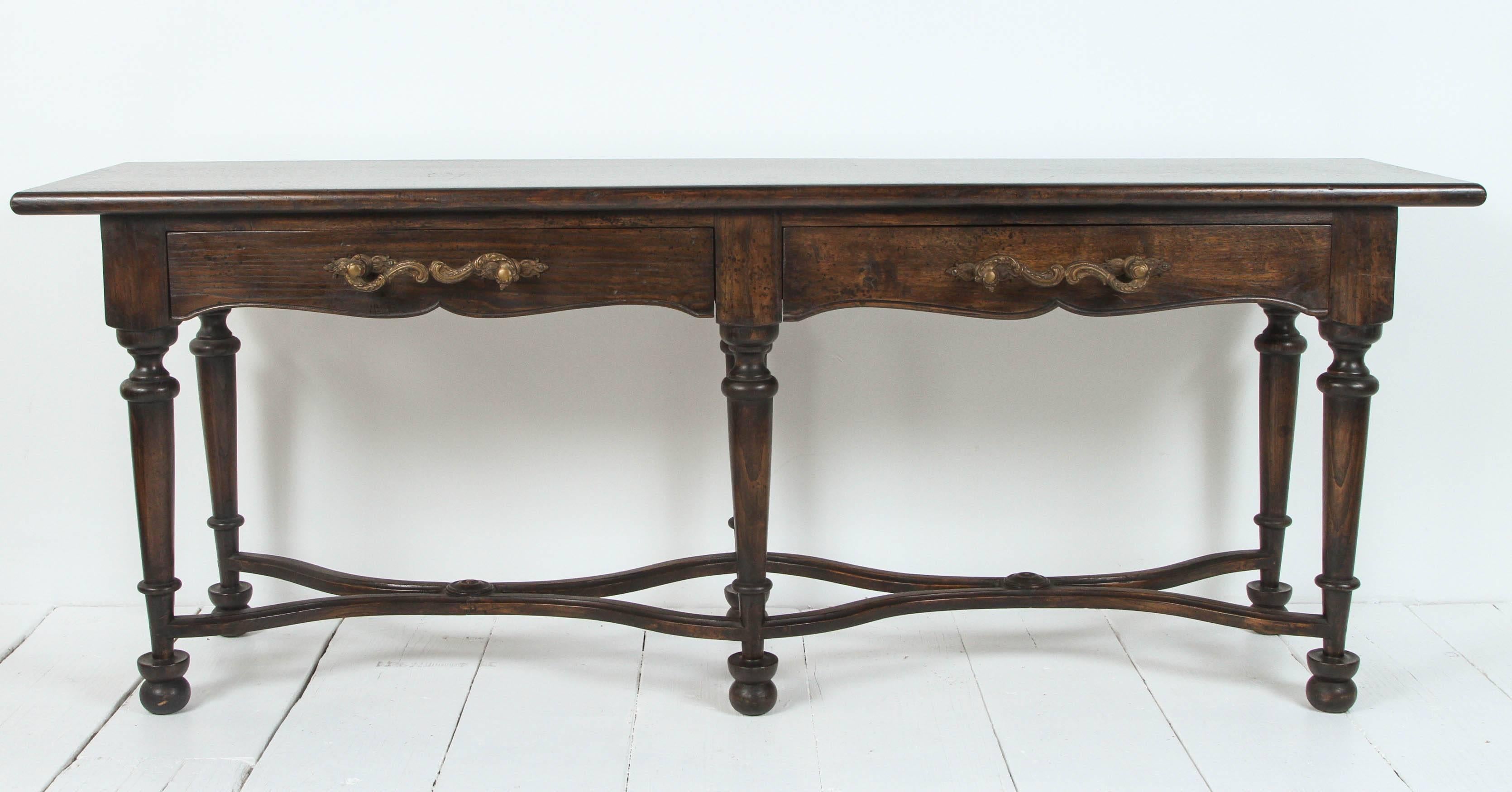 Vintage console with large wrought iron handles and six legs.