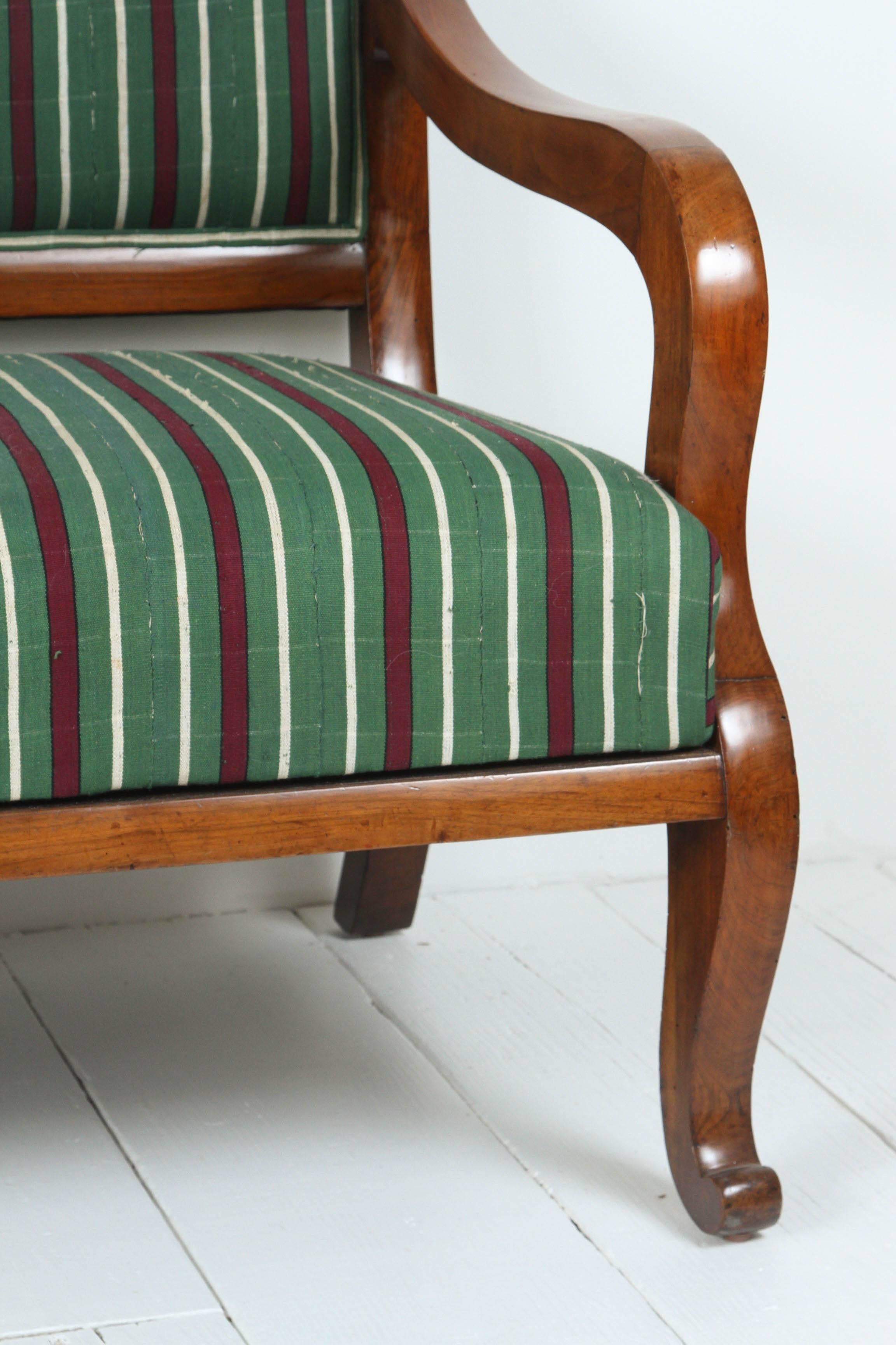Vintage Italian wood framed bench with curved legs upholstered in vintage African striped fabric.