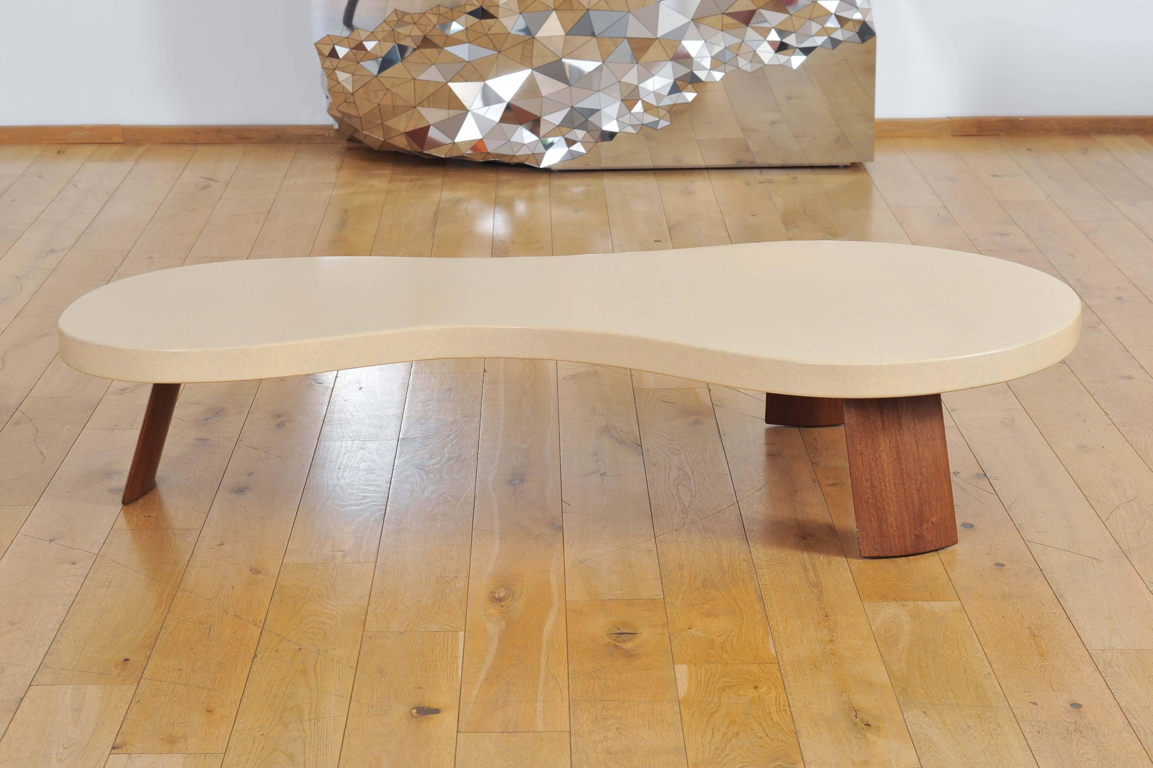 Coffee table by Paul Frankl, USA, circa 1948
for the Johnson Furniture Company
lacquered cork on mahogany legs
branded number on underside: 5005 166.