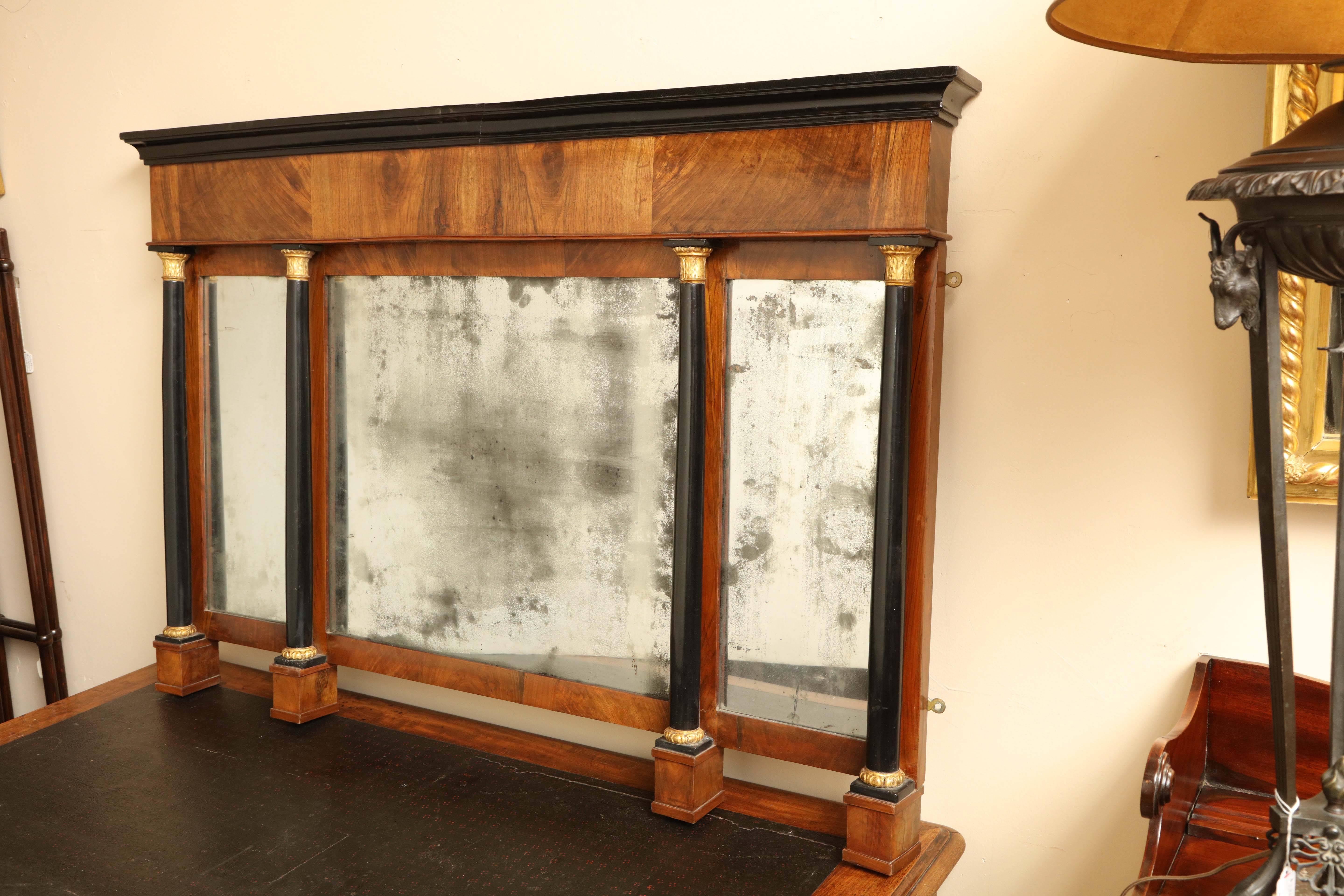 Early 19th century Biedermeier, walnut and ebonized mirror, overmantel with original glass.