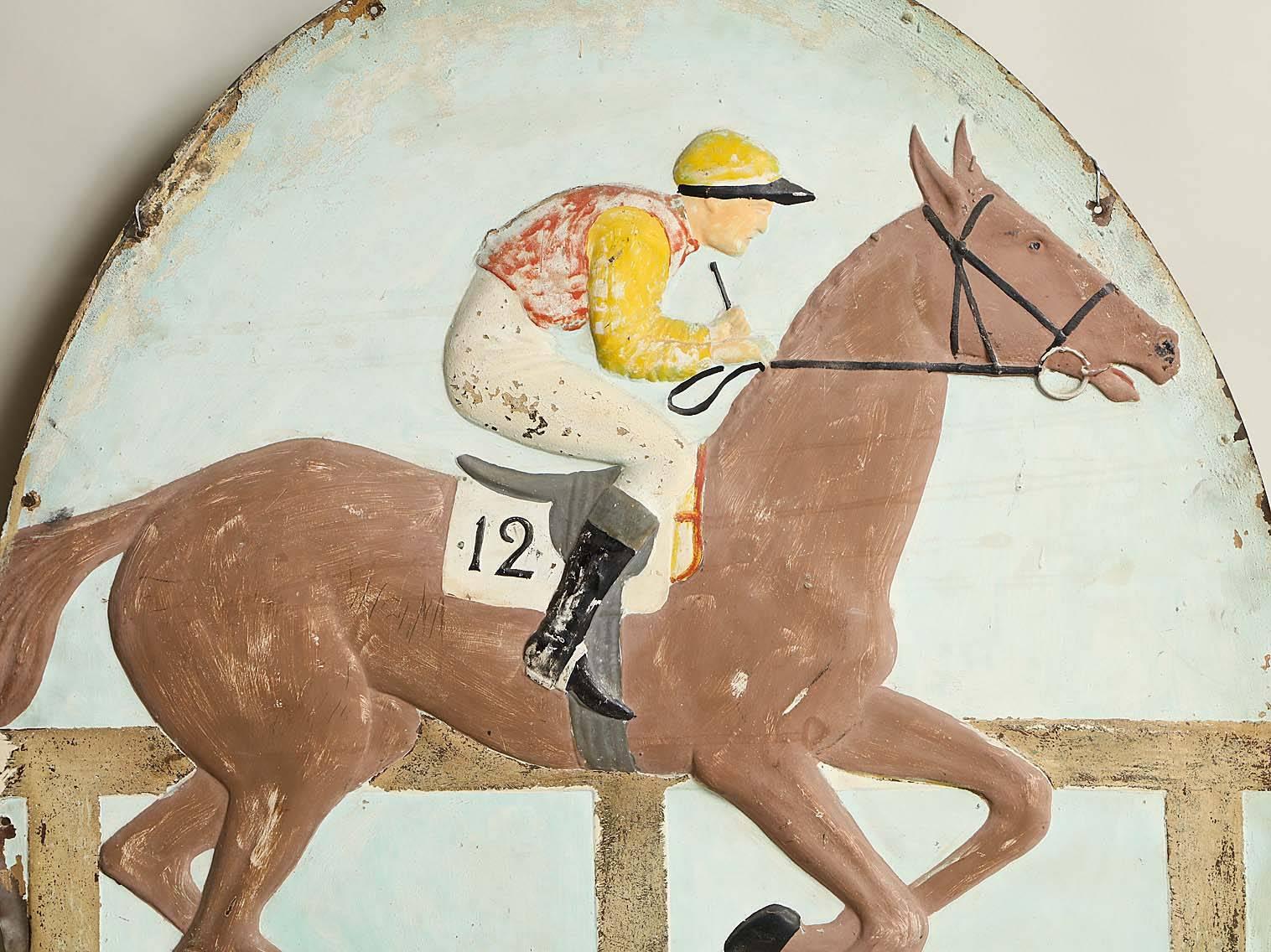 Great early 20th century hand-painted hammered copper pub sign depicting a yellow capped jockey riding a brown horse, England, circa 1920.
     
    