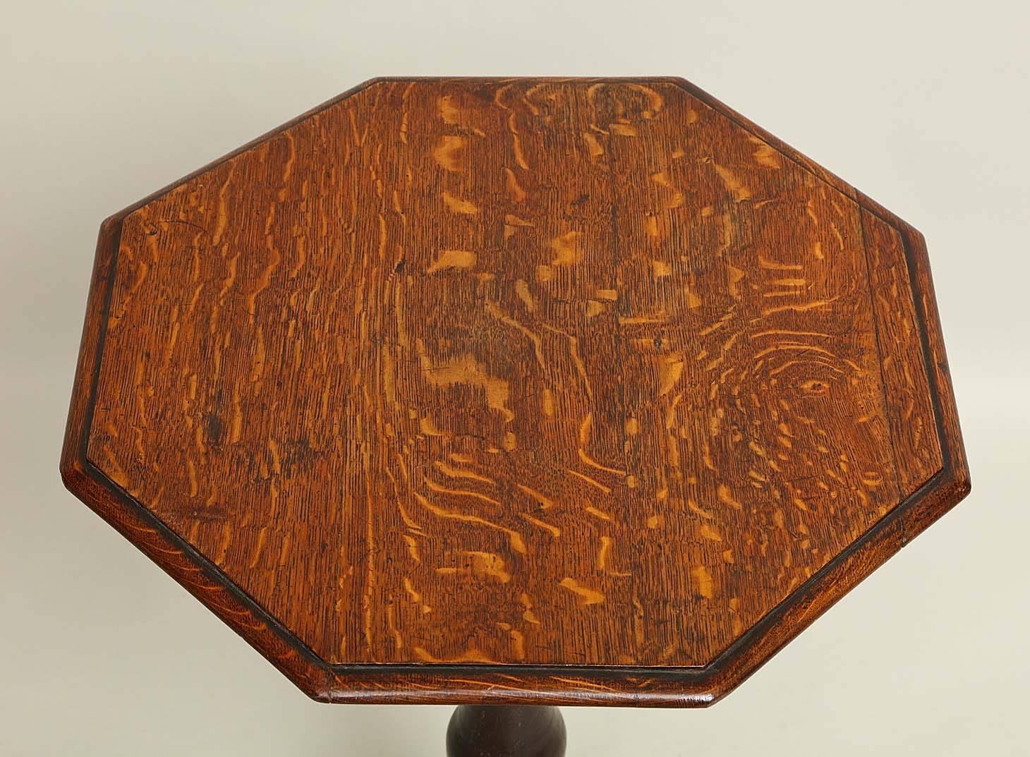 19th century English oak octagonal table, the molded top over boldly turned shaft, standing on shaped feet with unusual rounded lobe to the underside. The whole with pleasing mellow color.



 