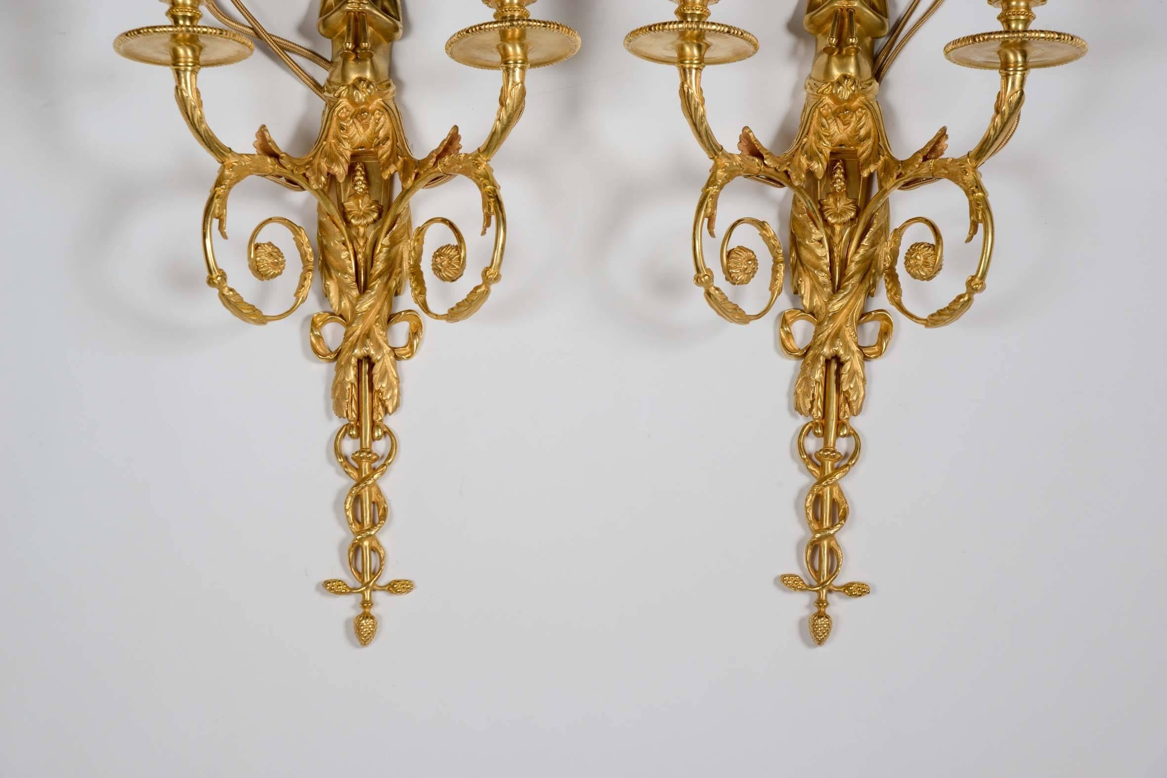 Pair of Louis XVI style wall sconces.
Gilded bronze.
Representing 