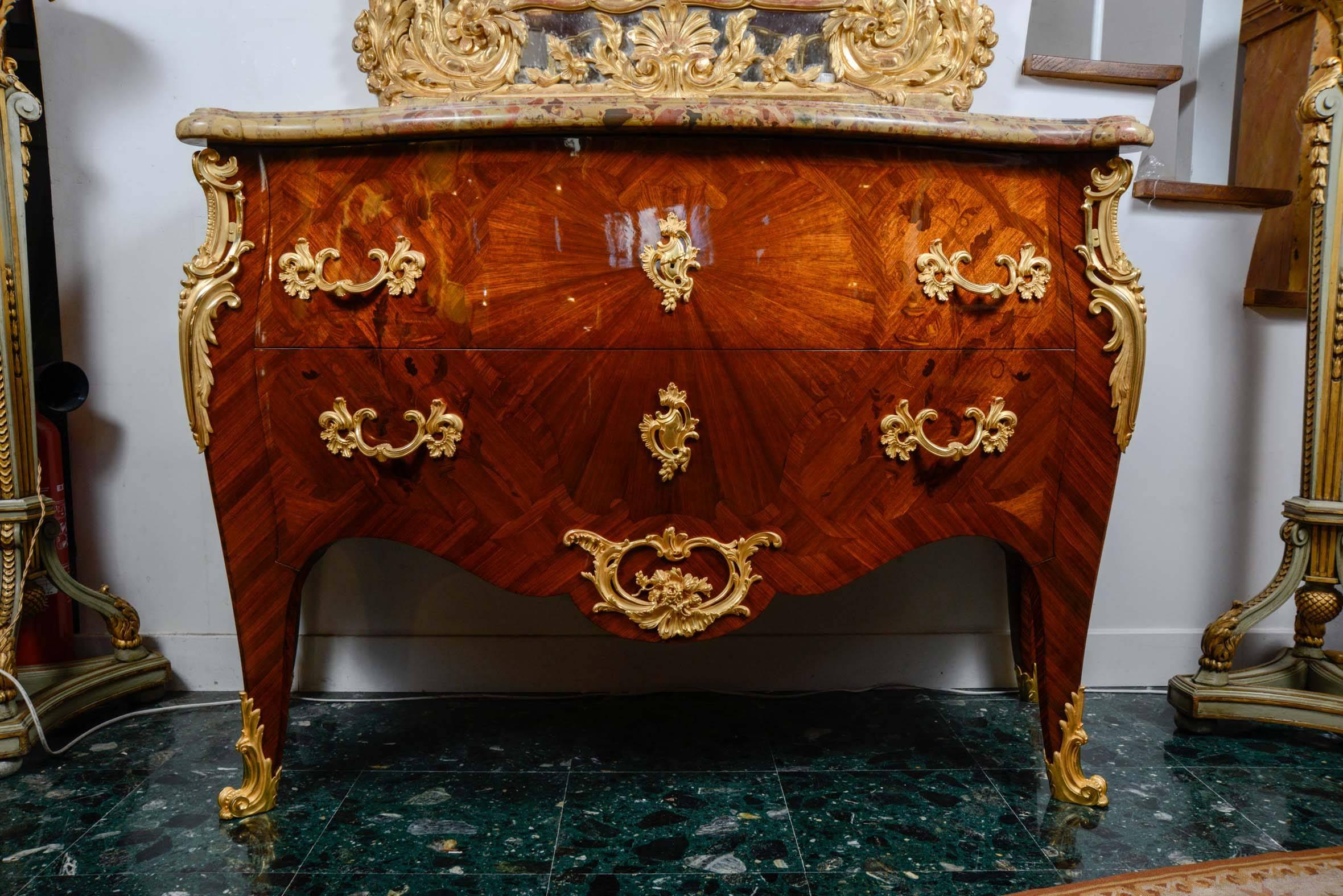 Gorgeous commode with two drawers, marquetry of precious wood, marble top
ornamented with sumptuous gilded bronzes.
Those commode is signed P Sormani.