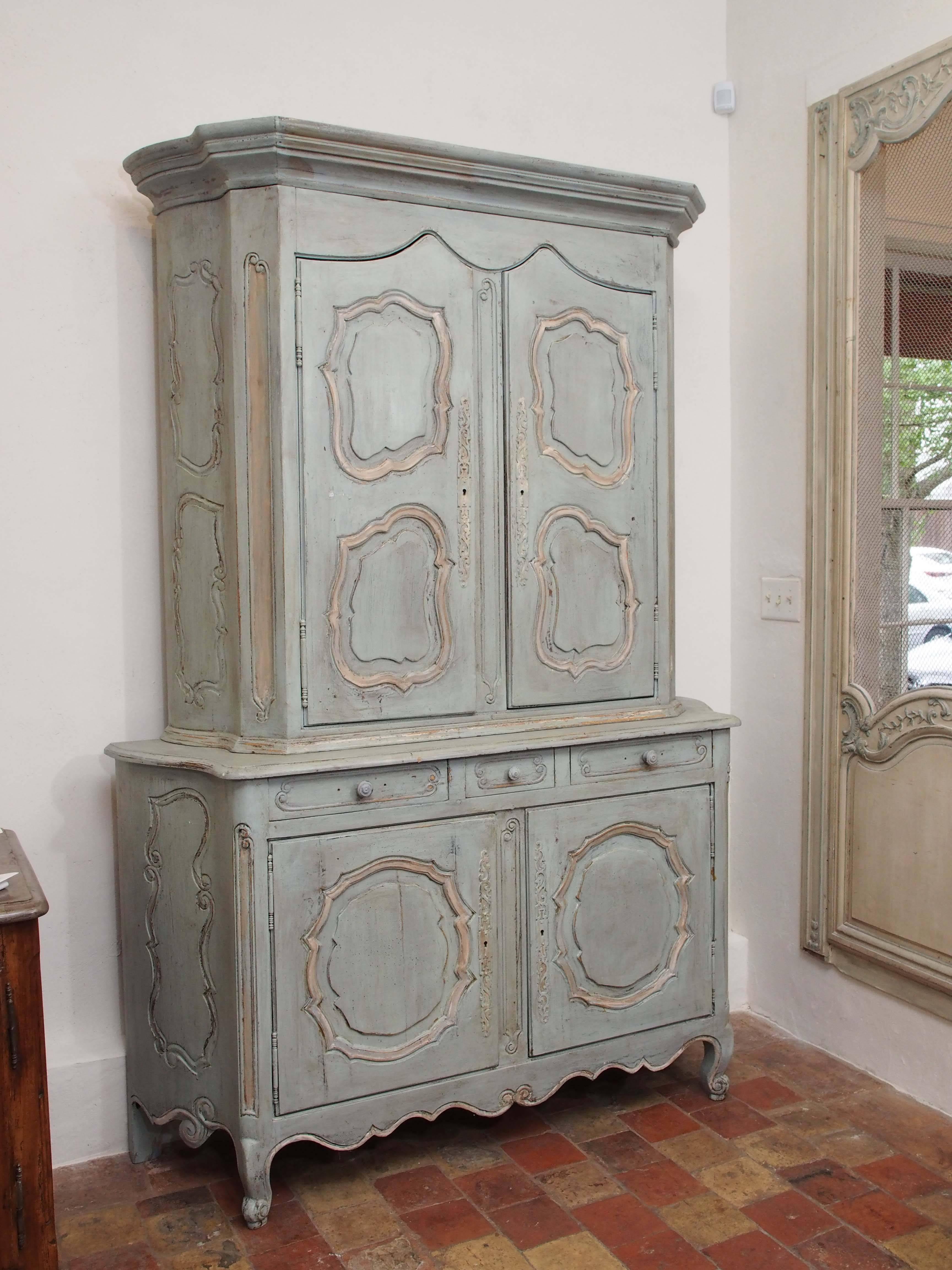 19th century French hand-painted and hand-carved buffet a deux corps in the Louis XV style with three drawers and four doors with iron hardware and wooded drawer pulls, circa 1840.