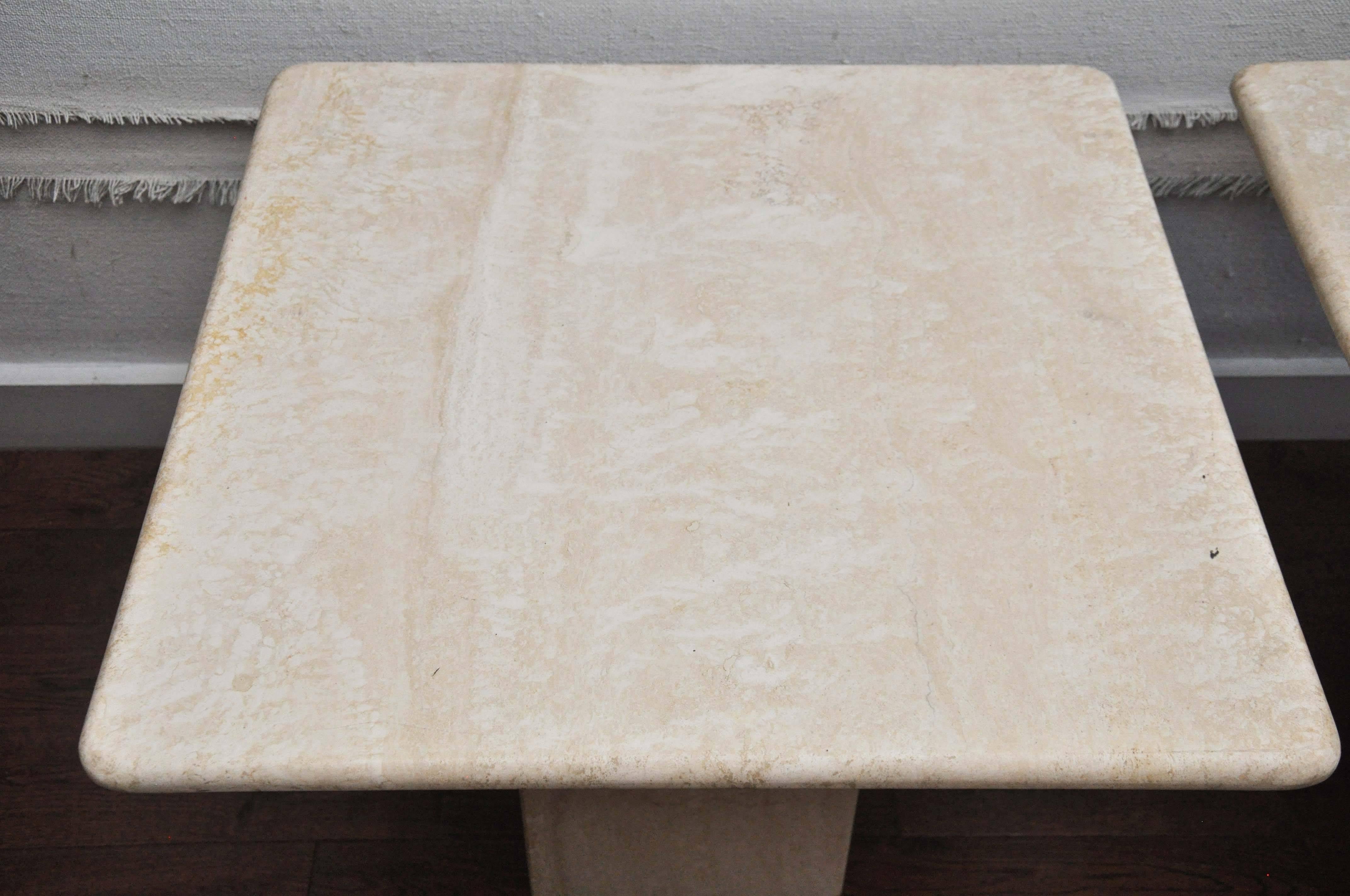 Mid-20th century pair of mid-century travertine tables.
Travertine is a form of limestone deposited by mineral springs, especially hot springs. Travertine often has a fibrous or concentric appearance and exists in white, tan, cream-colored, and