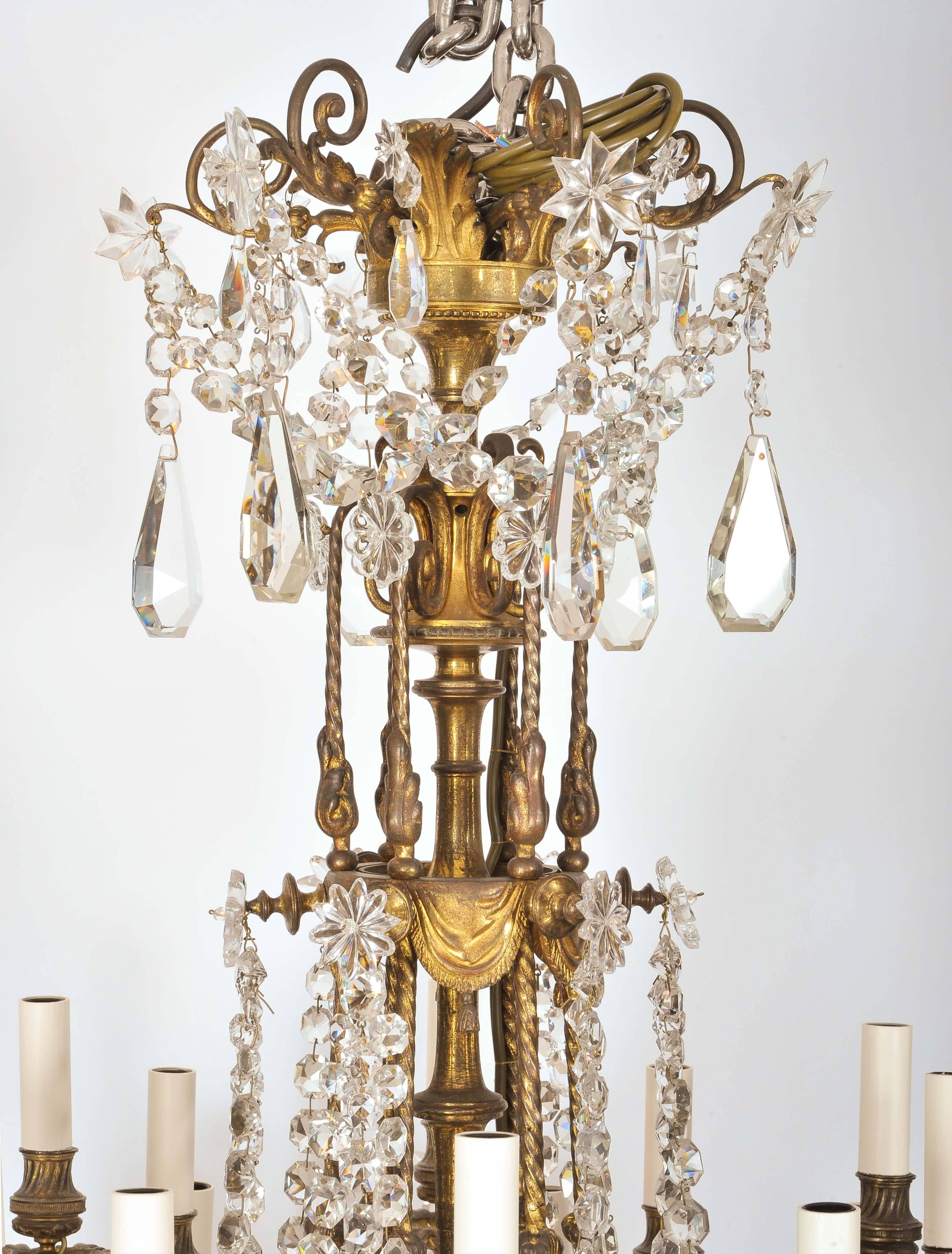 This superb and gorgeous mid-19th century Chandelier is designed from ormolu and crystal with two tiers. Each tier has six branches, the top tier with a singular branch and light, while the lower tier has a singular branch that divides to three
