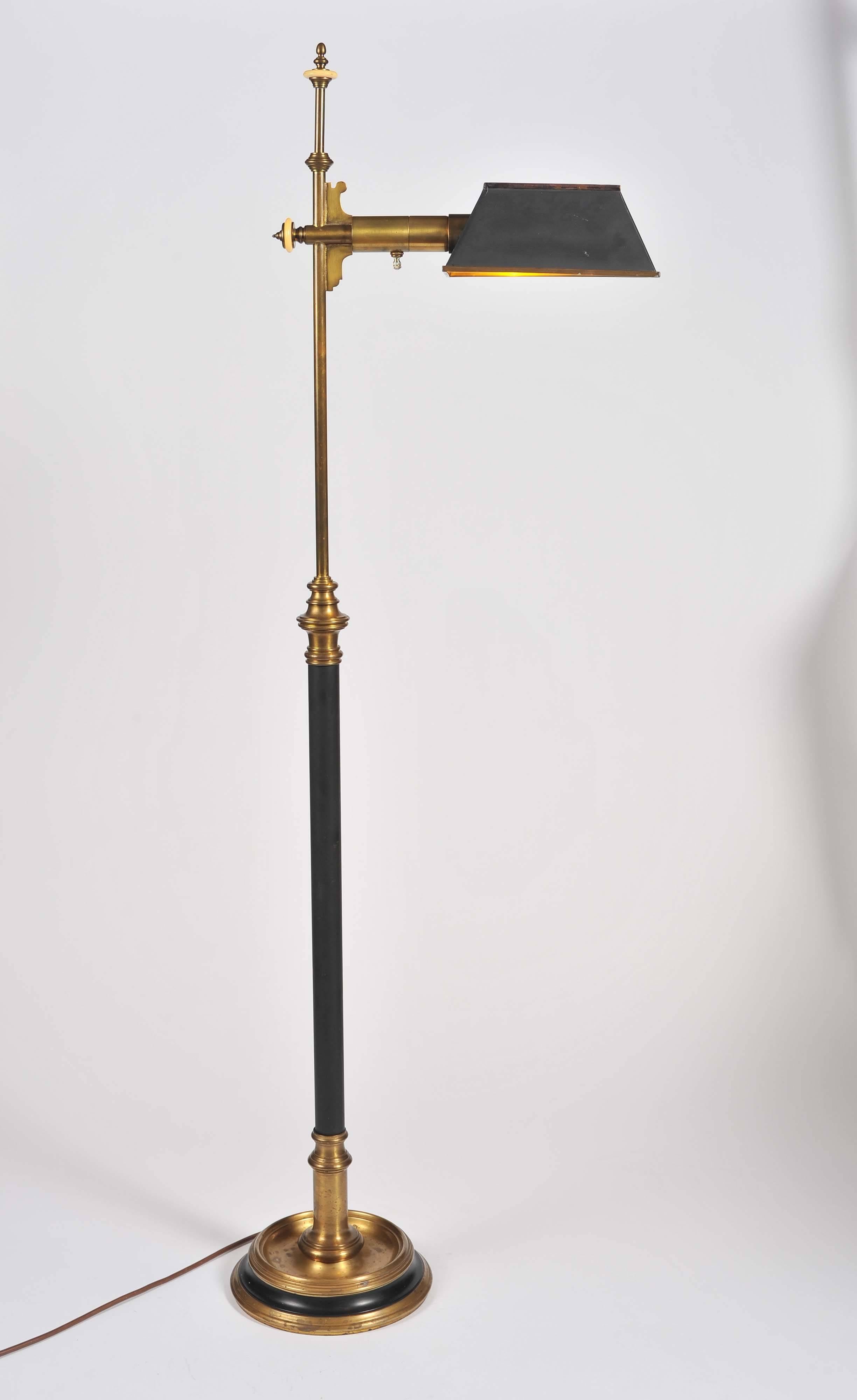 A very elegant brass Chapman standard lamp with rotating adjustable rectangular toleware shade.