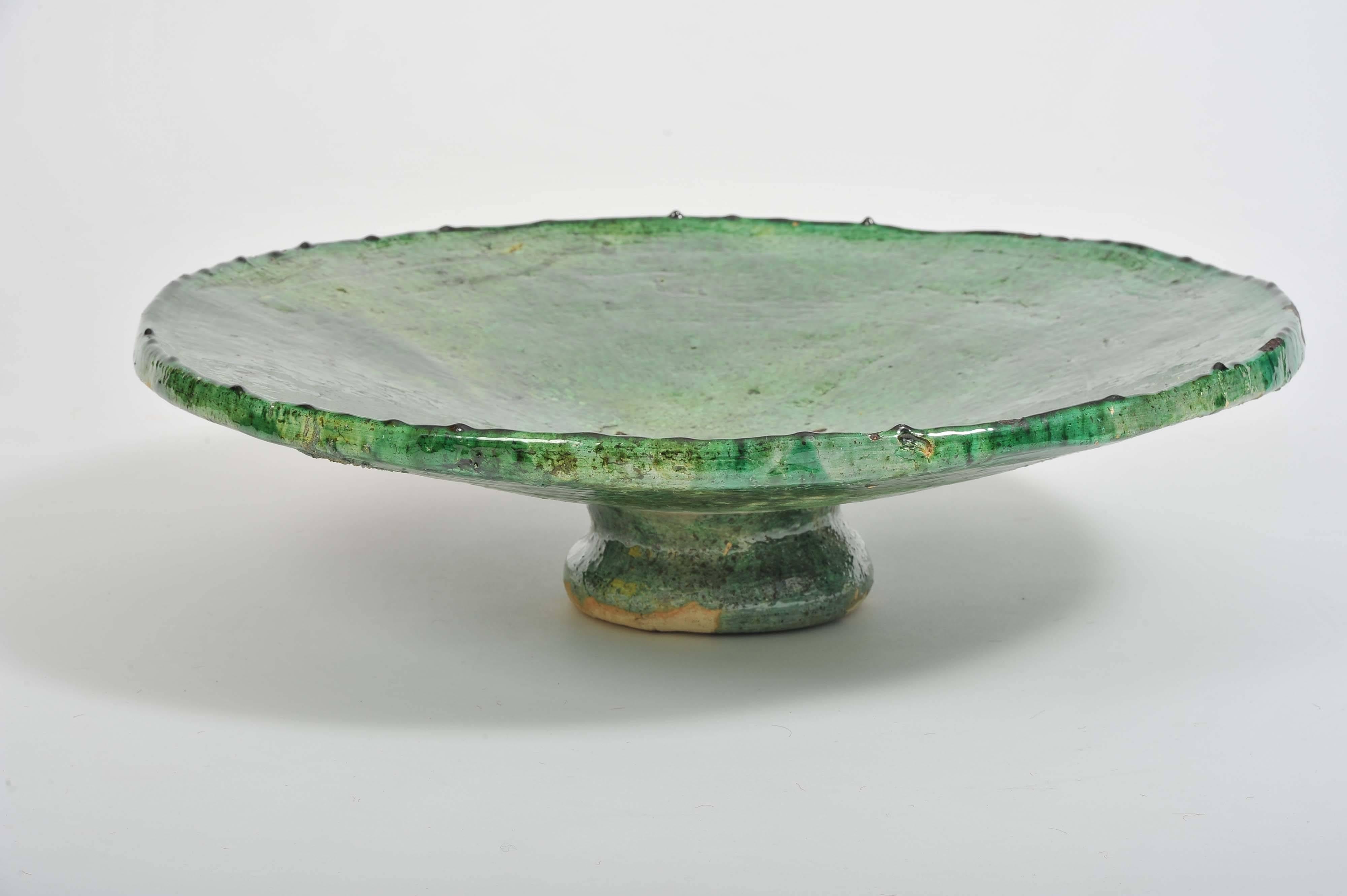 A beautiful 1970s north African example of ethnic green pottery ceramic finish serving dish. 

Maker unknown.
 