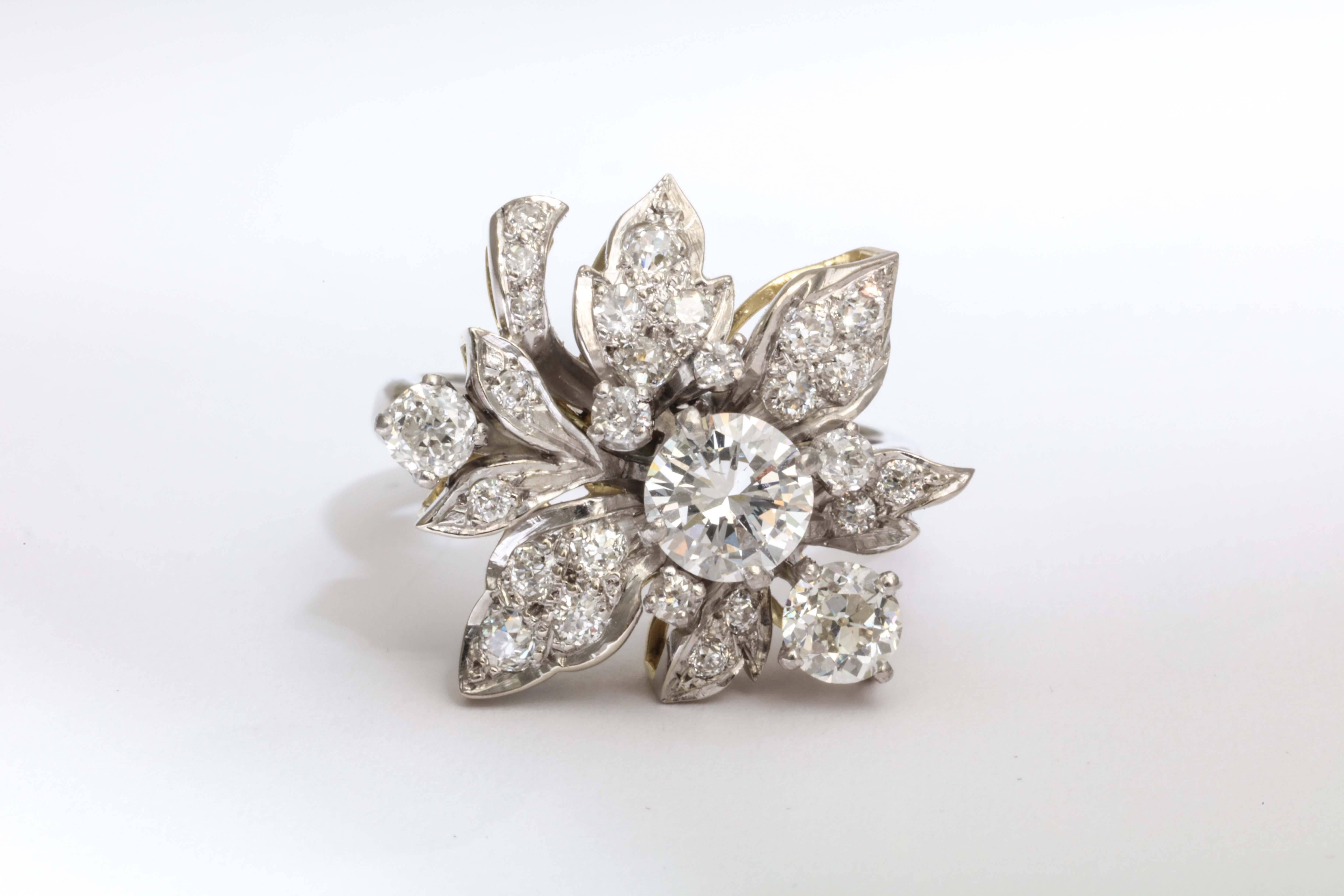 A stunning diamond and platinum flower ring with a center diamond of 1-carat with a total of 3-carat.