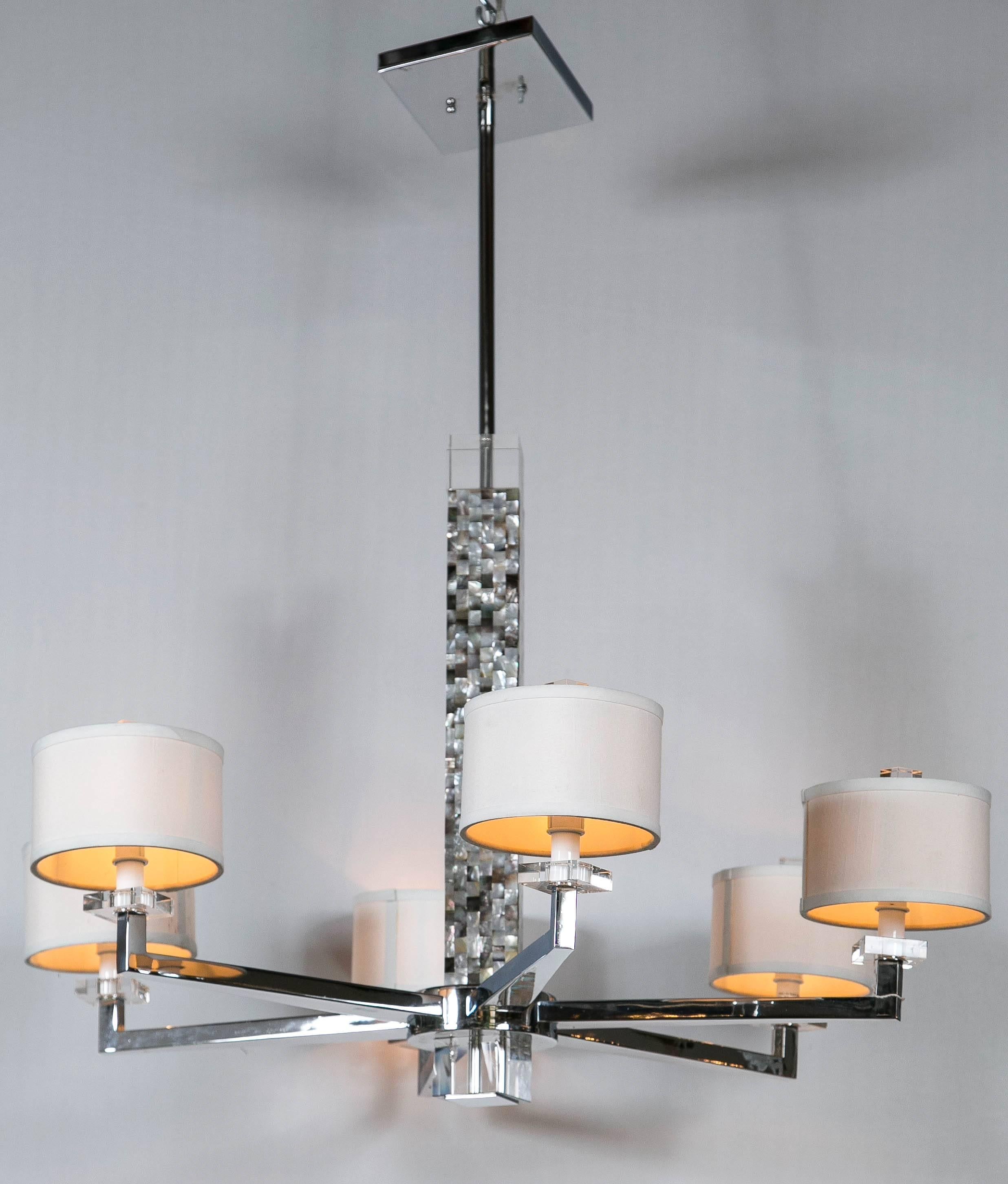 A mother-of-pearl Micro mosaic decorated chandelier. The chrome six-light fixture having circular shades supported by a Micromosaic style center square support. Newly wired. This is a part of our recently expanded lighting section featuring hundreds