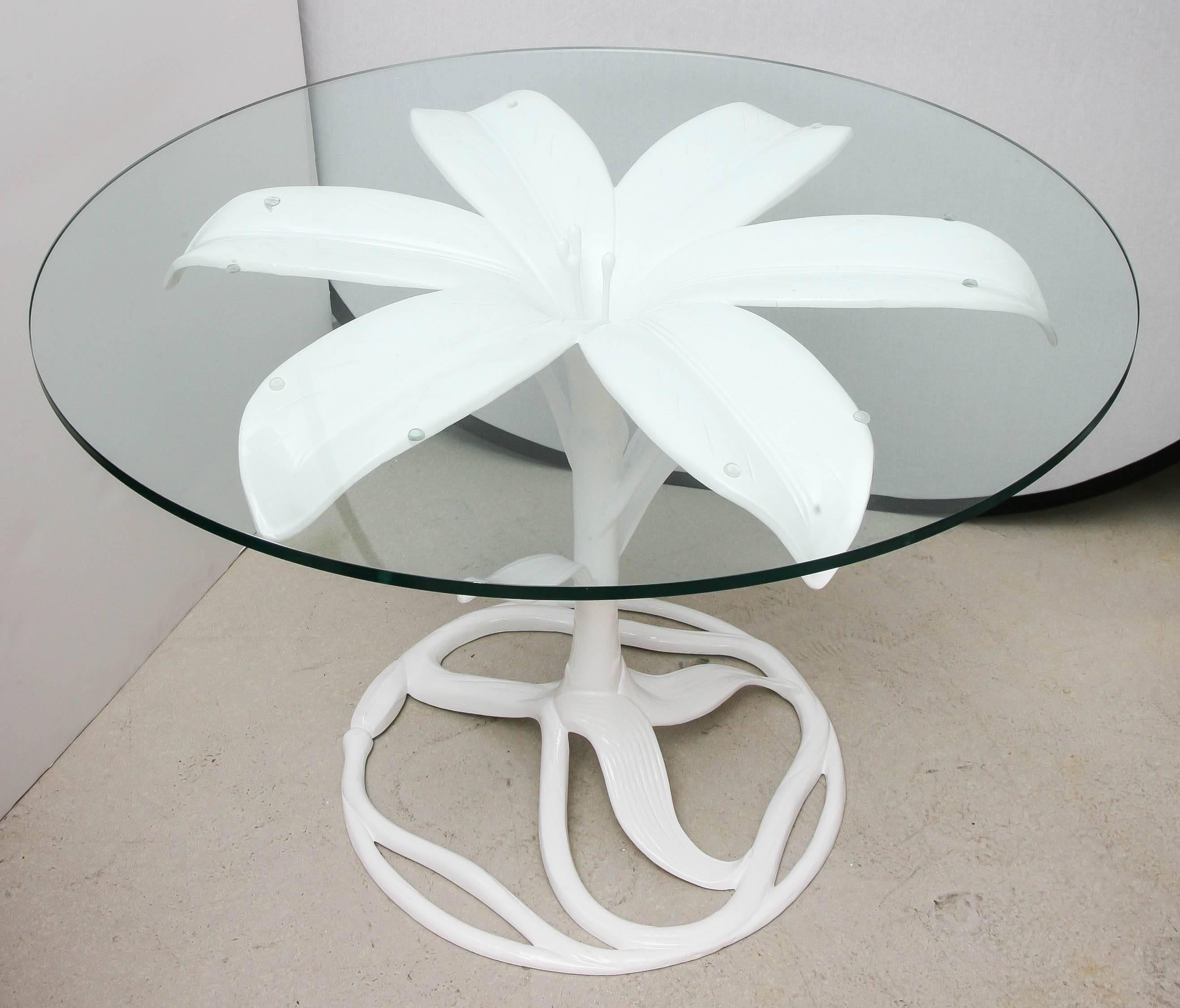 Arthur Court aluminum lily table in white lacquer with circular glass top.