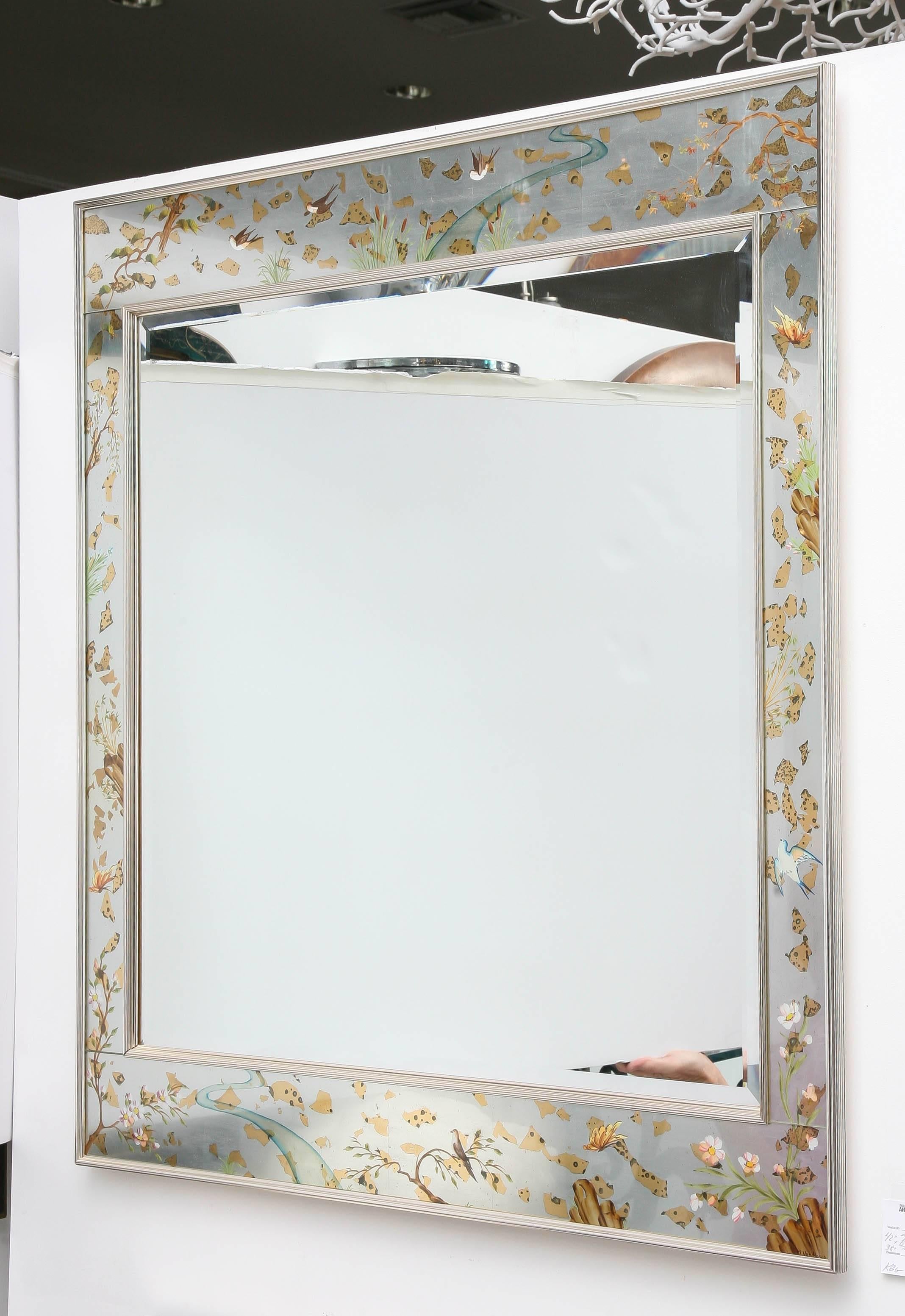 Vintage La Barge reverse painted mirror with flora and fauna. The frame of the mirror is aluminum. It is signed.