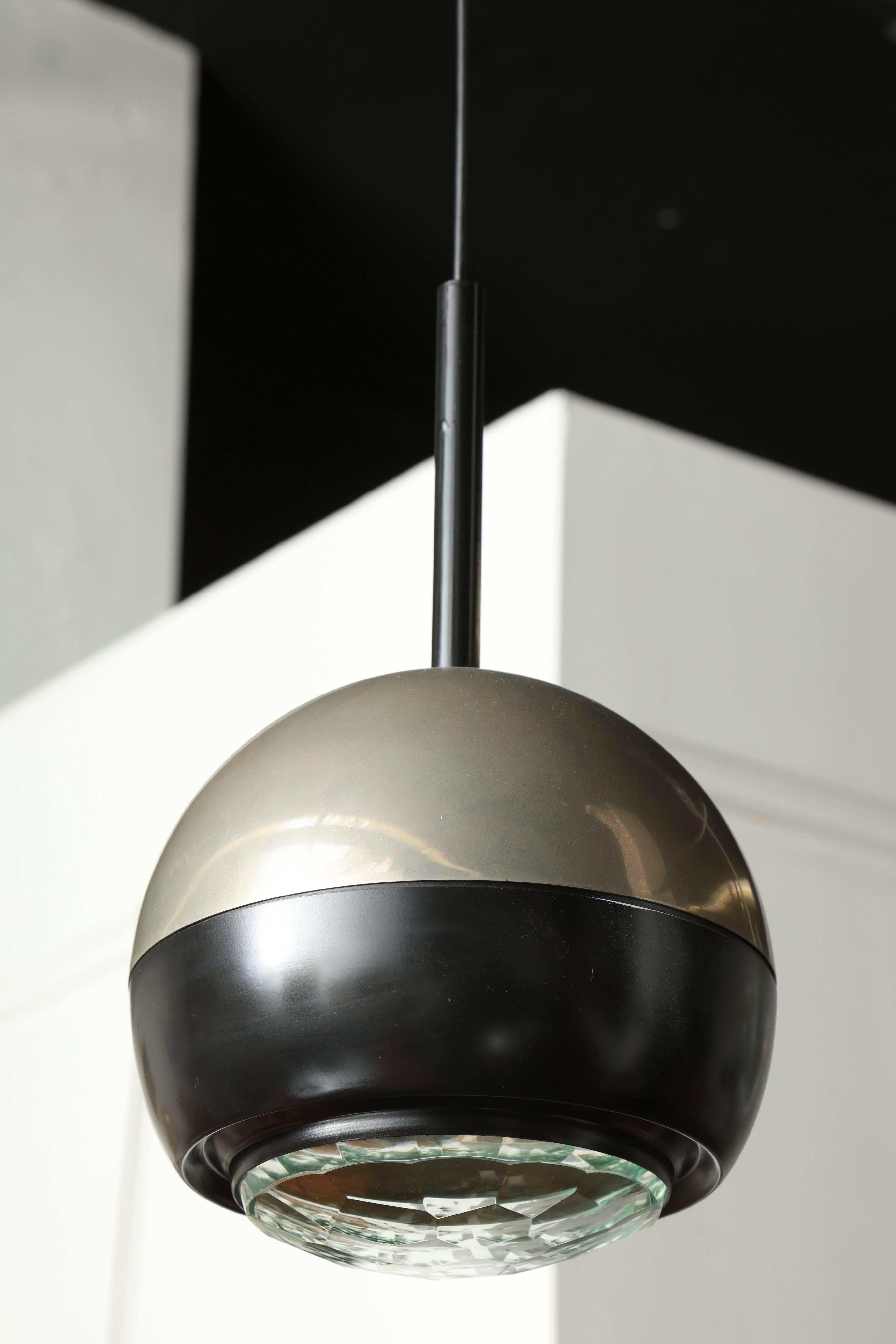 Exciting modernist pendant light made in Milan 1960 by Stilnovo. Nickel finish with a border in black lacquer and a cut-glass shade, adjustable wire can be made longer or shorter, great form, takes one incandescent bulb.
 