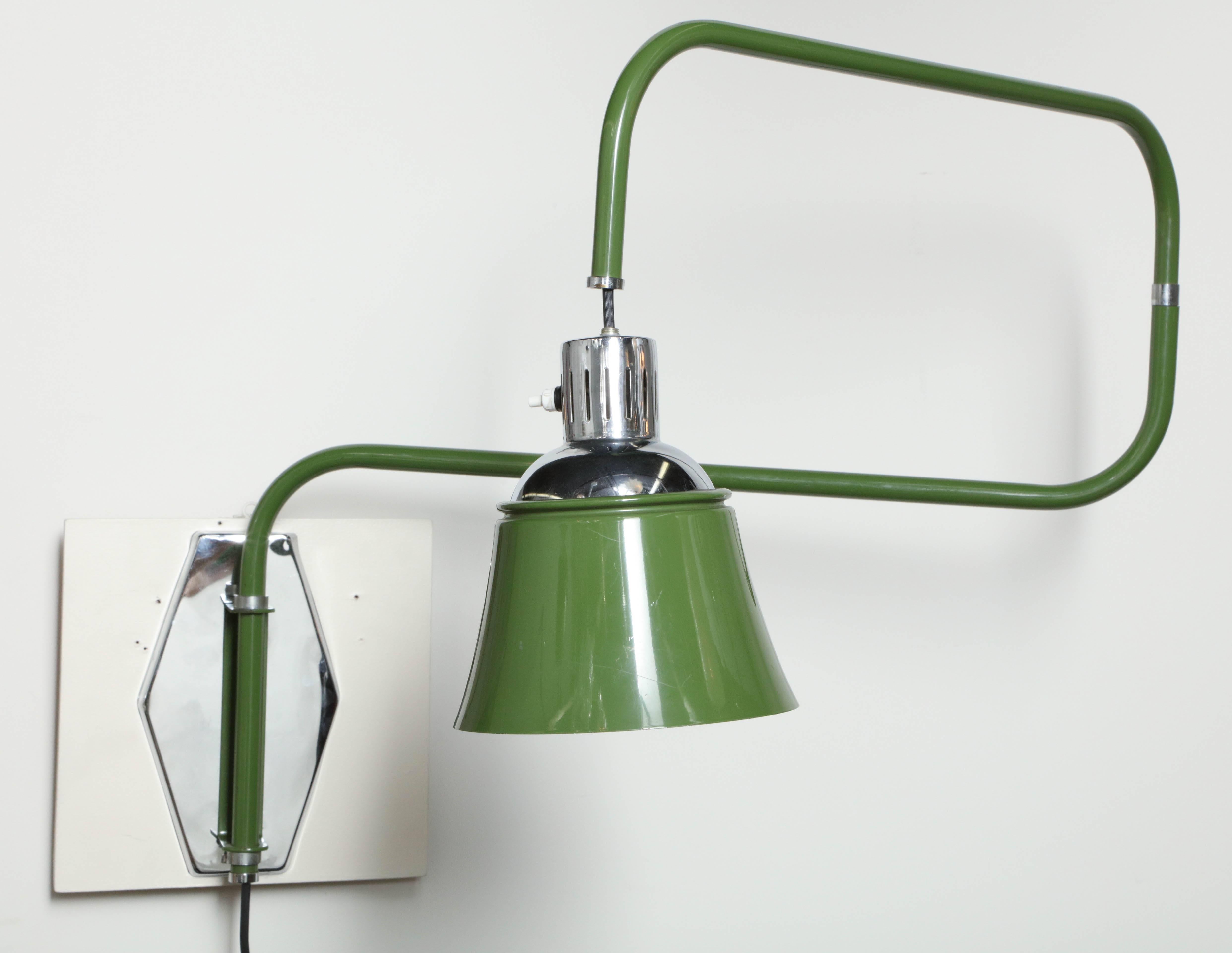 Bauhaus / art deco swing arm wall light designed by Heinrich Siegfried Bormann in 1930 who was a designer for the Bauhaus. Adjustable pull down shade that also can be adjusted to shine the light in any direction by pivoting the shade.  Made in